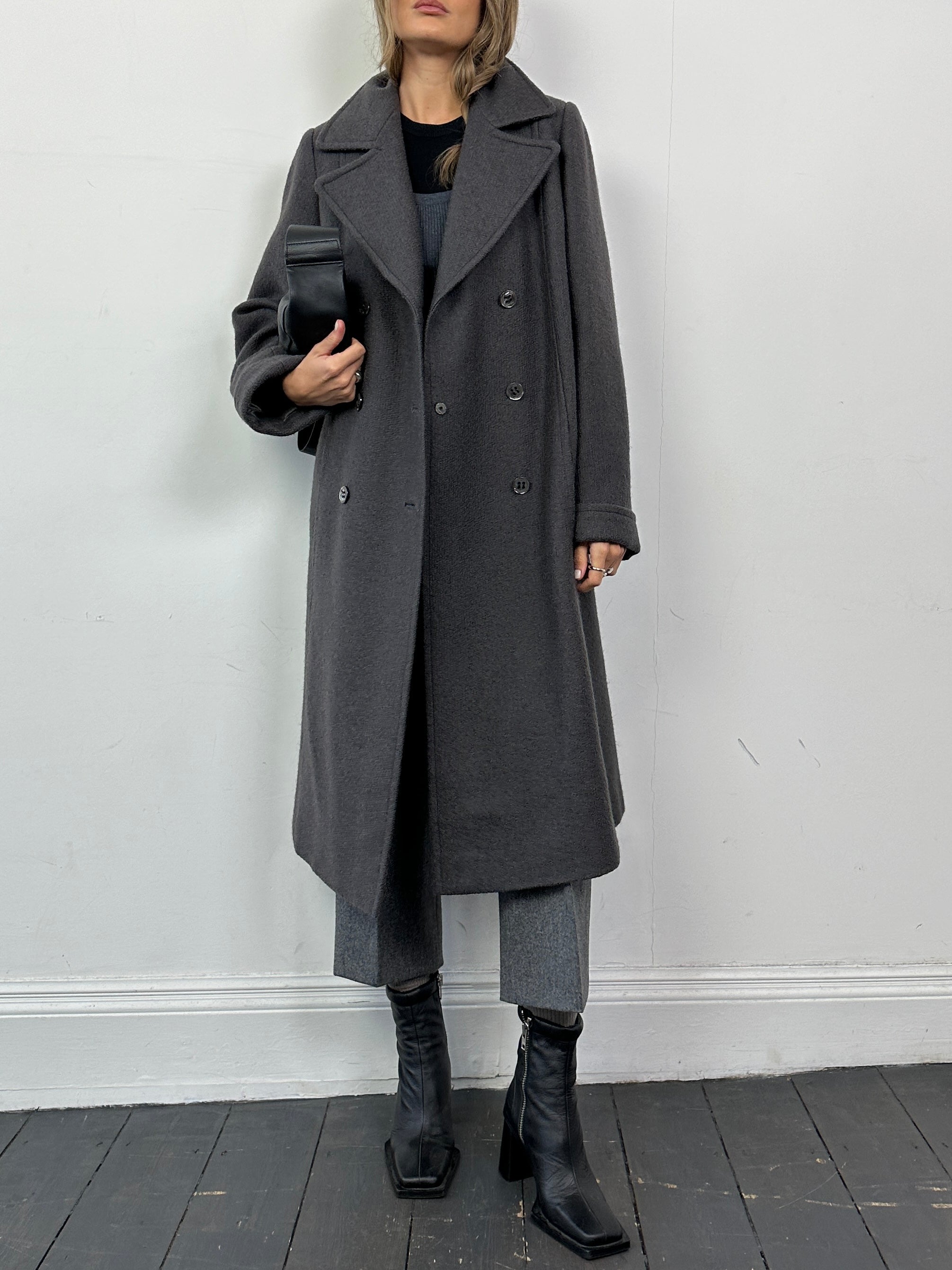 Vintage wool double-breasted A-line coat in classic style, featuring a tailored fit and timeless design for women.