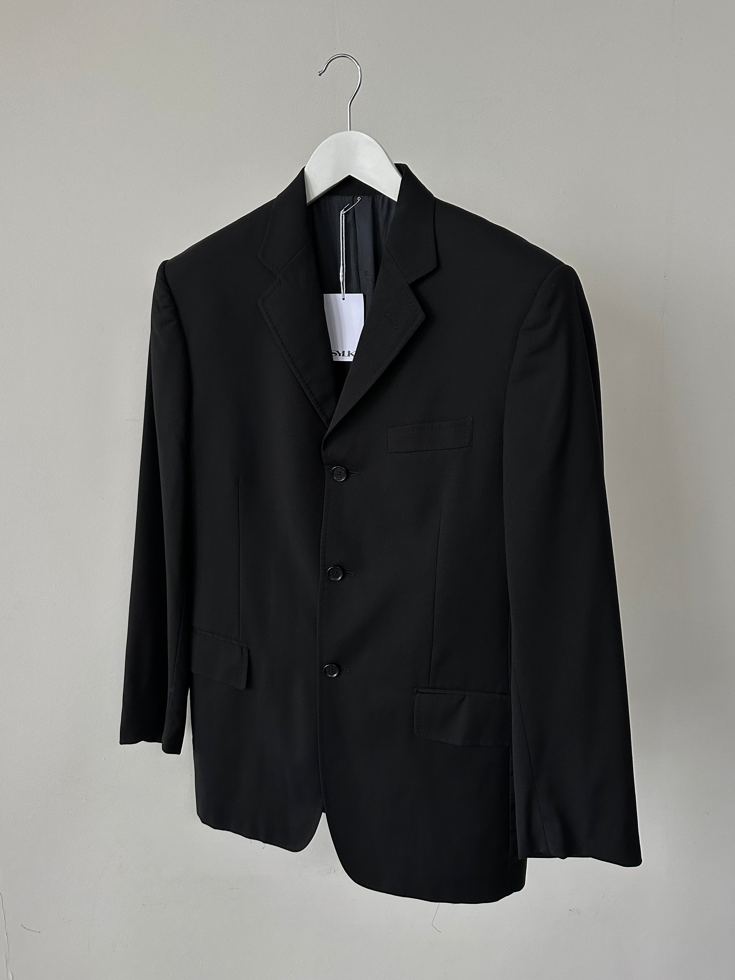Dolce & Gabbana single-breasted virgin wool blazer in size M, tailored fit with classic lapel and button closure.