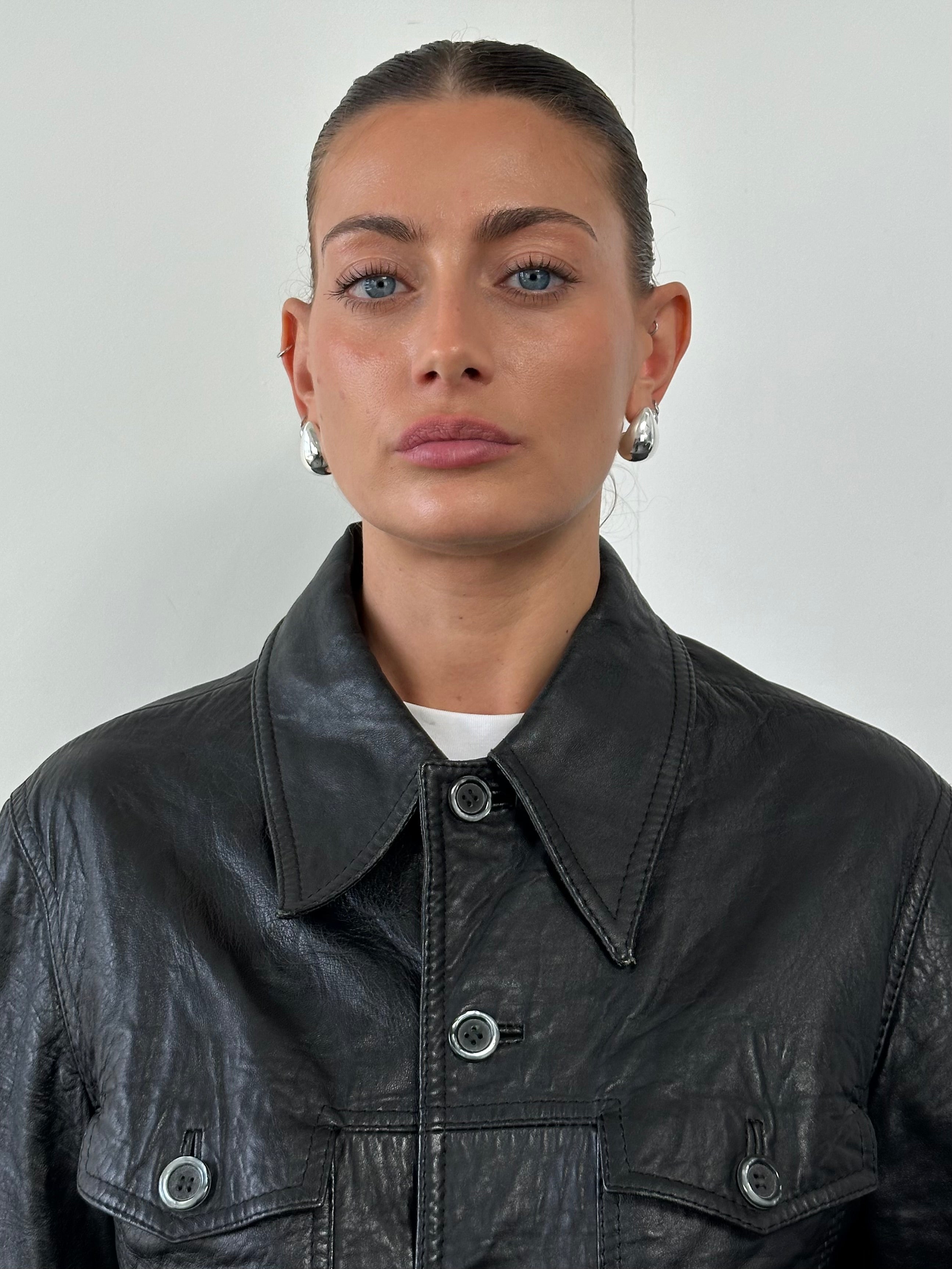 Vintage leather jacket with dagger collar detail, size small, stylish vintage men's or women's leather outerwear.