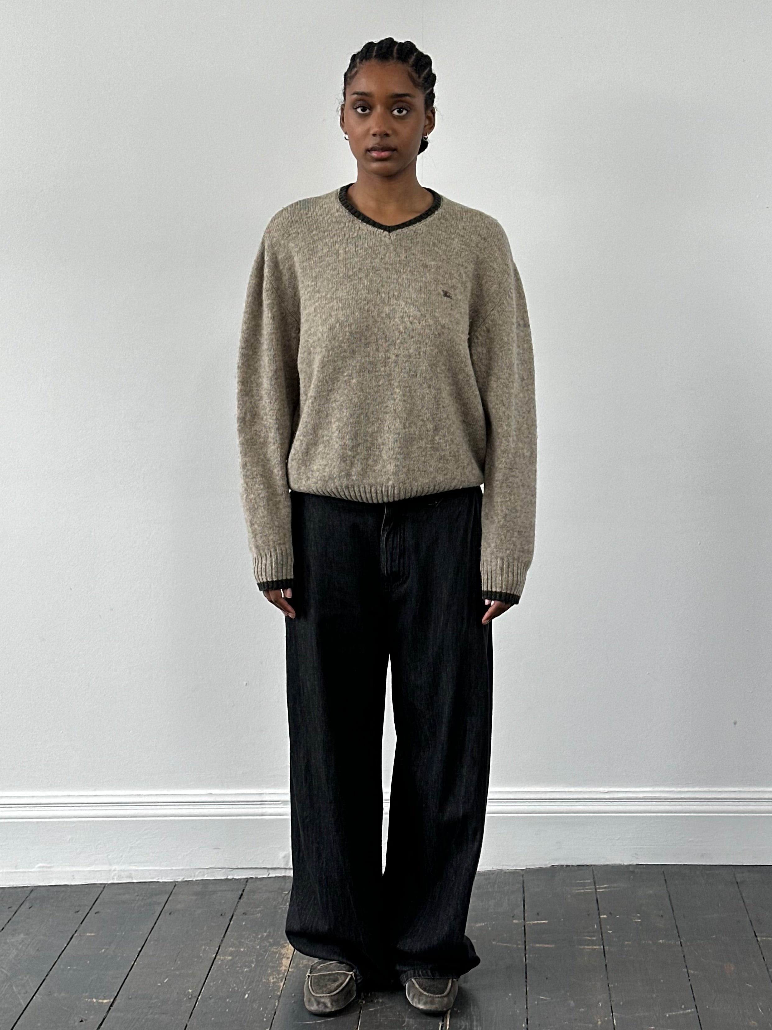 Burberry London 2000s Merino wool V-neck knitted jumper in size M/L, featuring classic beige color and textured knit pattern.