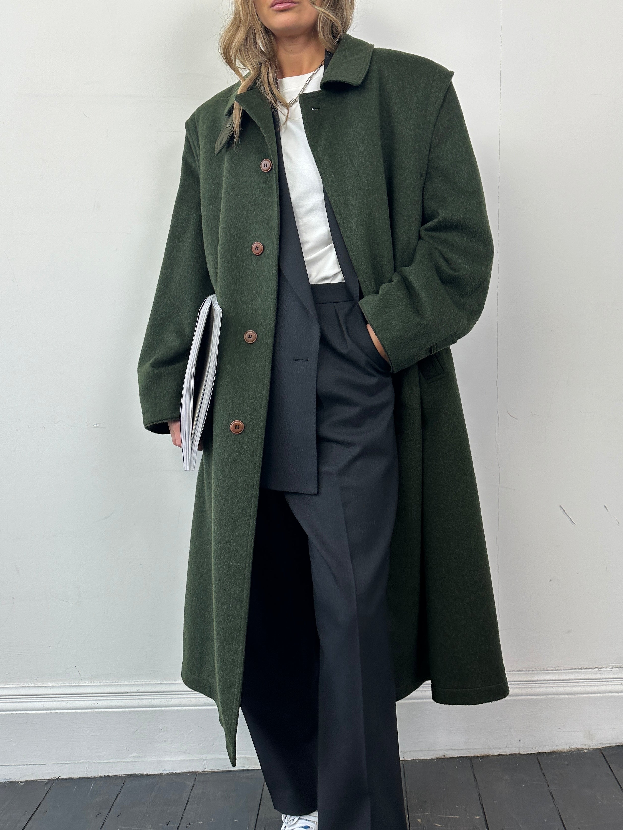 Vintage wool coat with concealed placket, single-breasted design in size XL, featuring classic tailored style and textured fabric.