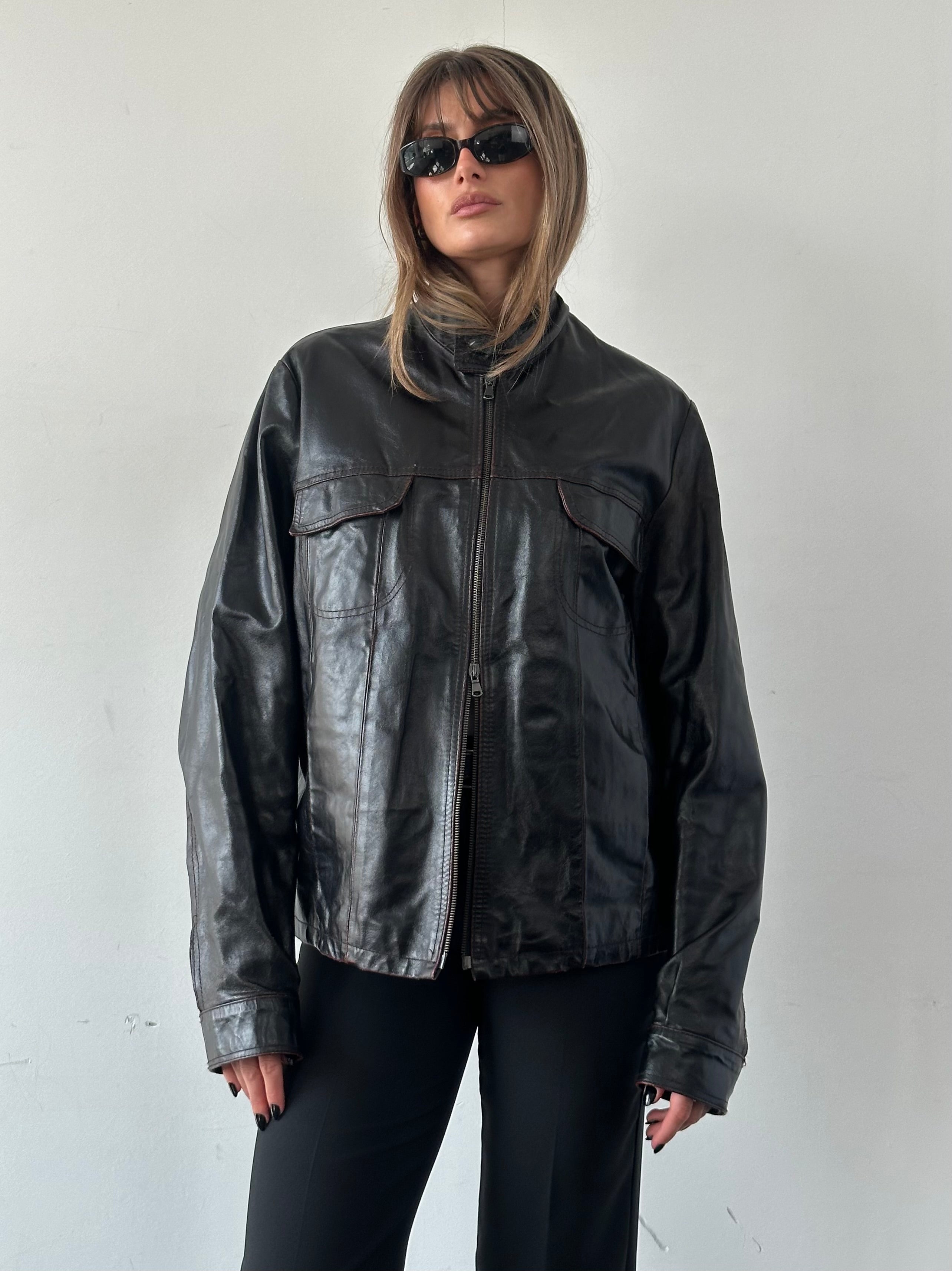 Italian Vintage double zip distressed leather jacket in size L/XL, featuring rugged style and worn-in leather texture.