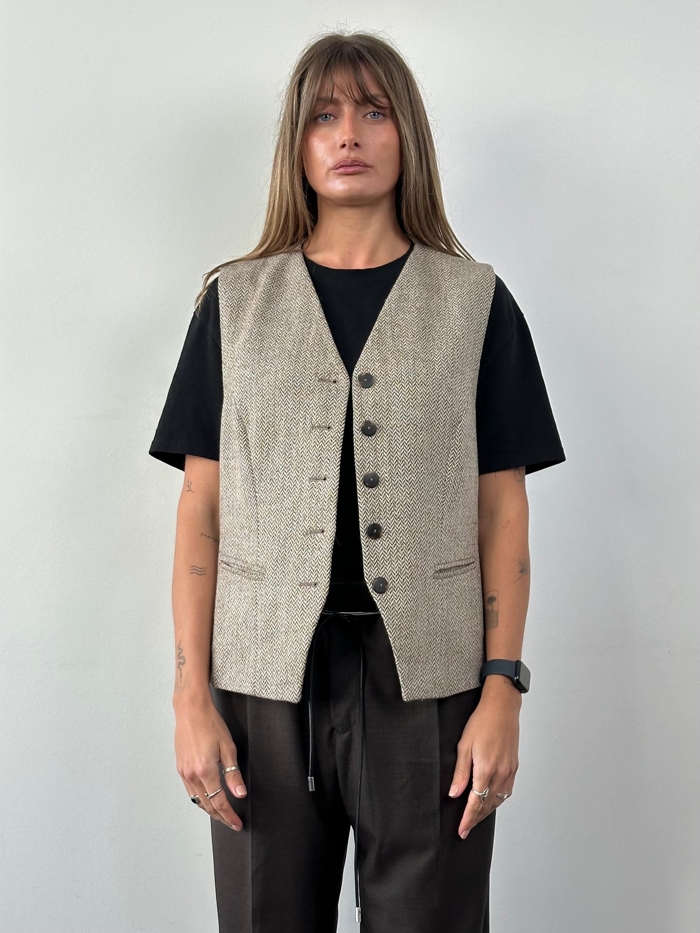 Vintage 1990s virgin wool herringbone waistcoat in XL, showcasing classic pattern and tailored fit on a mannequin.
