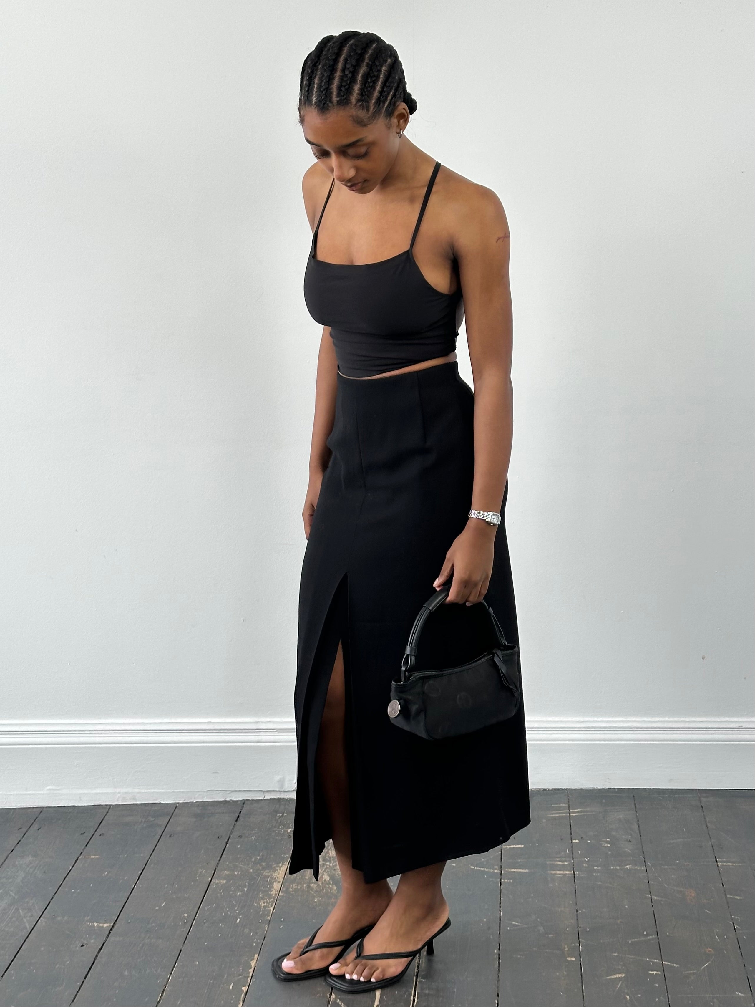 Jaeger 1990s pure wool side split maxi skirt in neutral color, featuring a high waist and flowing silhouette.
