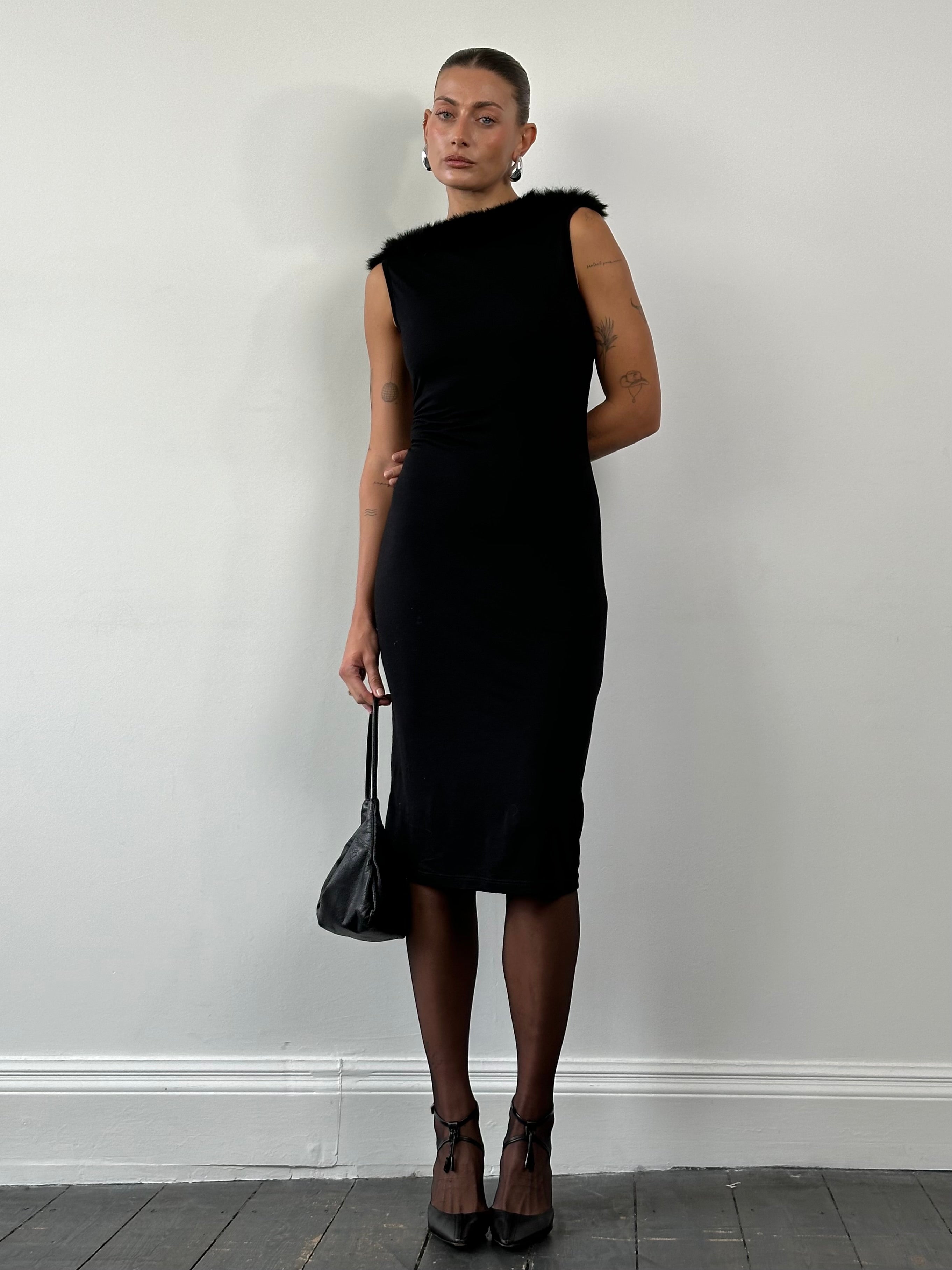 Moschino 1990s feather-trim boat neck midi dress in black, featuring elegant feather details and a classic silhouette.