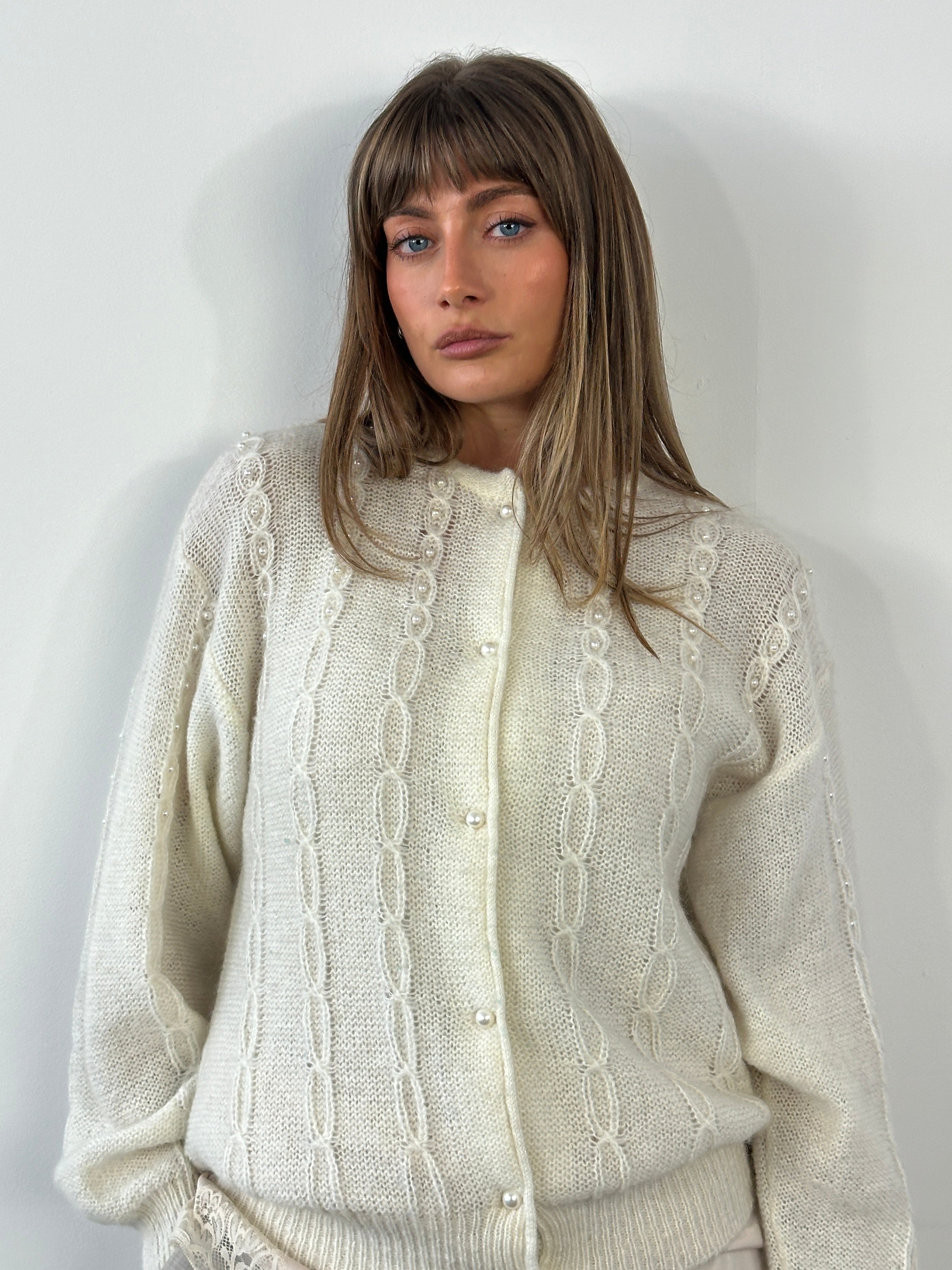 Vintage Italian 1980s mohair knitted cardigan, medium size, featuring a cozy, textured design in soft, vibrant colors.