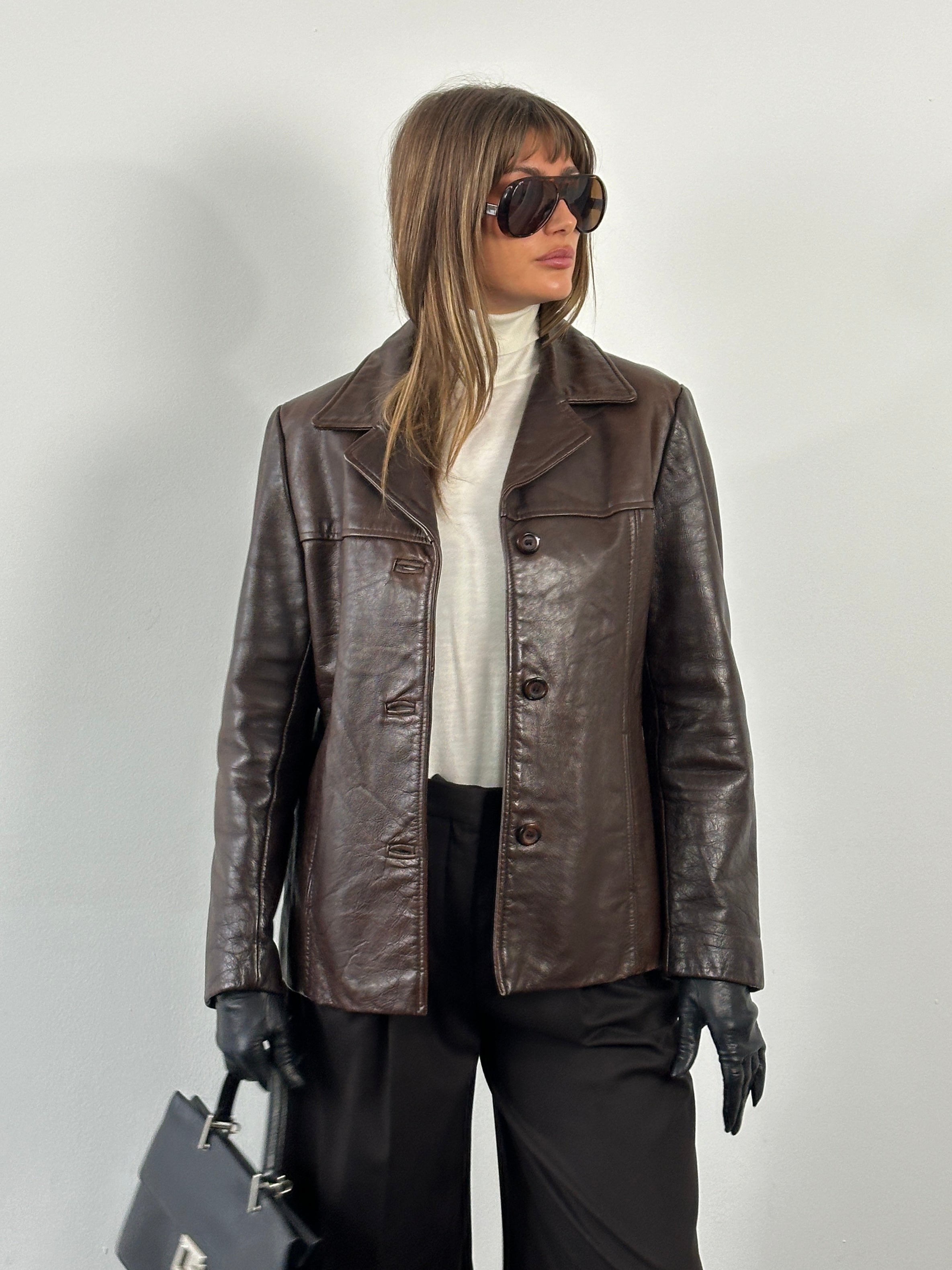 Vintage 1990s high button leather jacket in size M, classic black leather with stylish detailing and a vintage-inspired design.