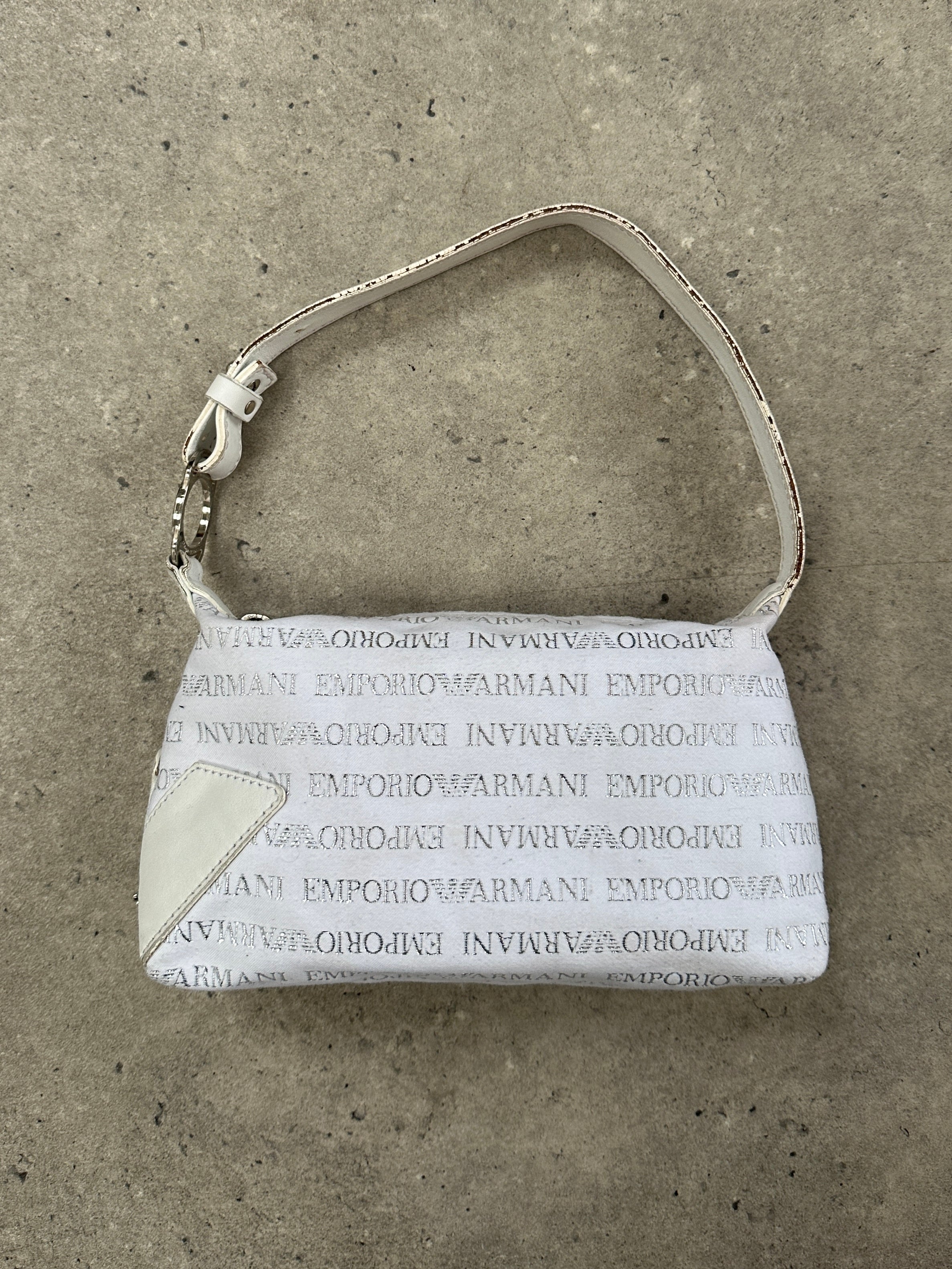 Emporio Armani Monogram shoulder bag featuring the signature logo pattern and sleek design, made of high-quality material.