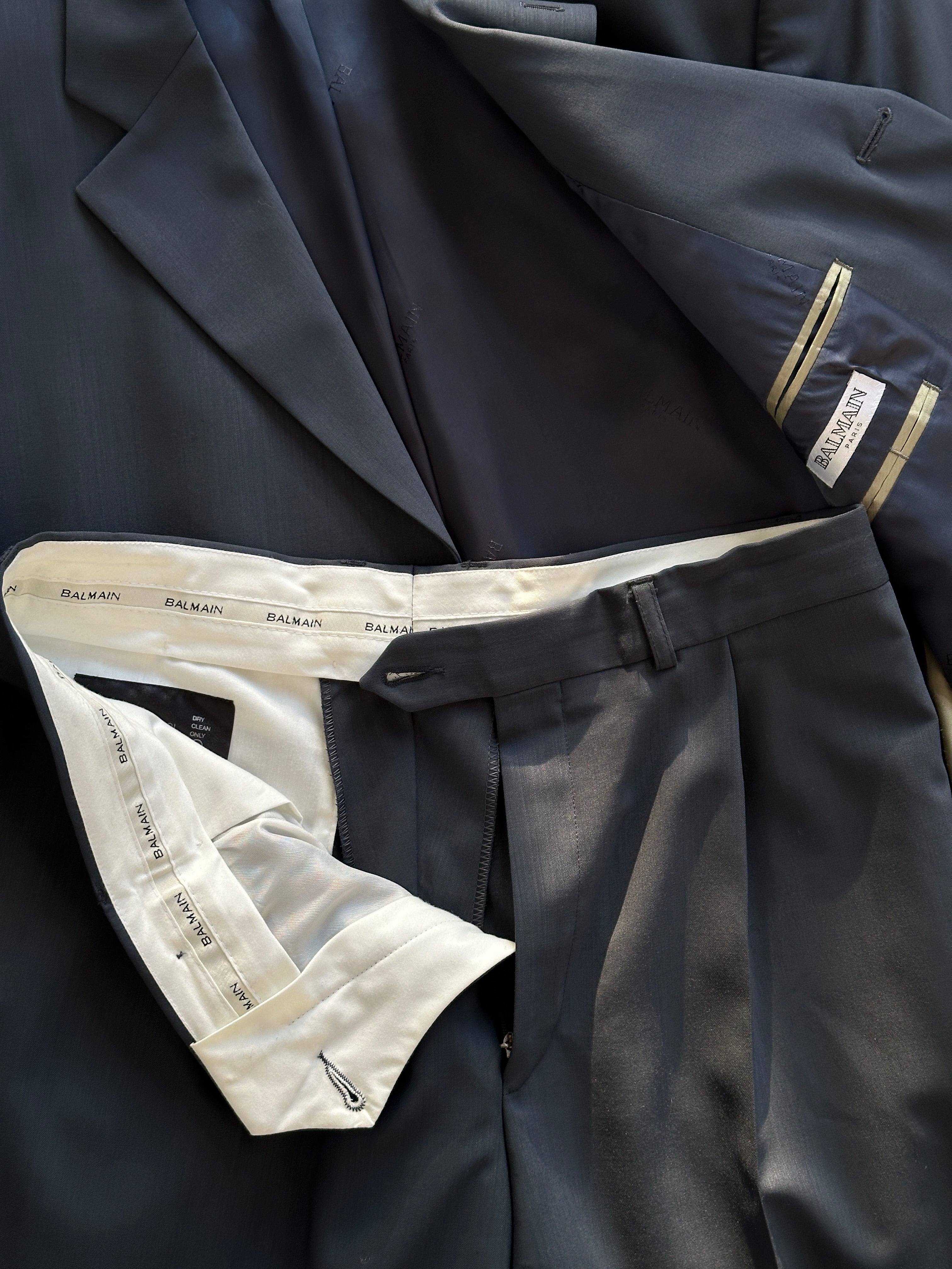 Balmain pure wool single-breasted suit jumpsuit in size 38S/W32, shown on a model with tailored fit and classic lapel details.