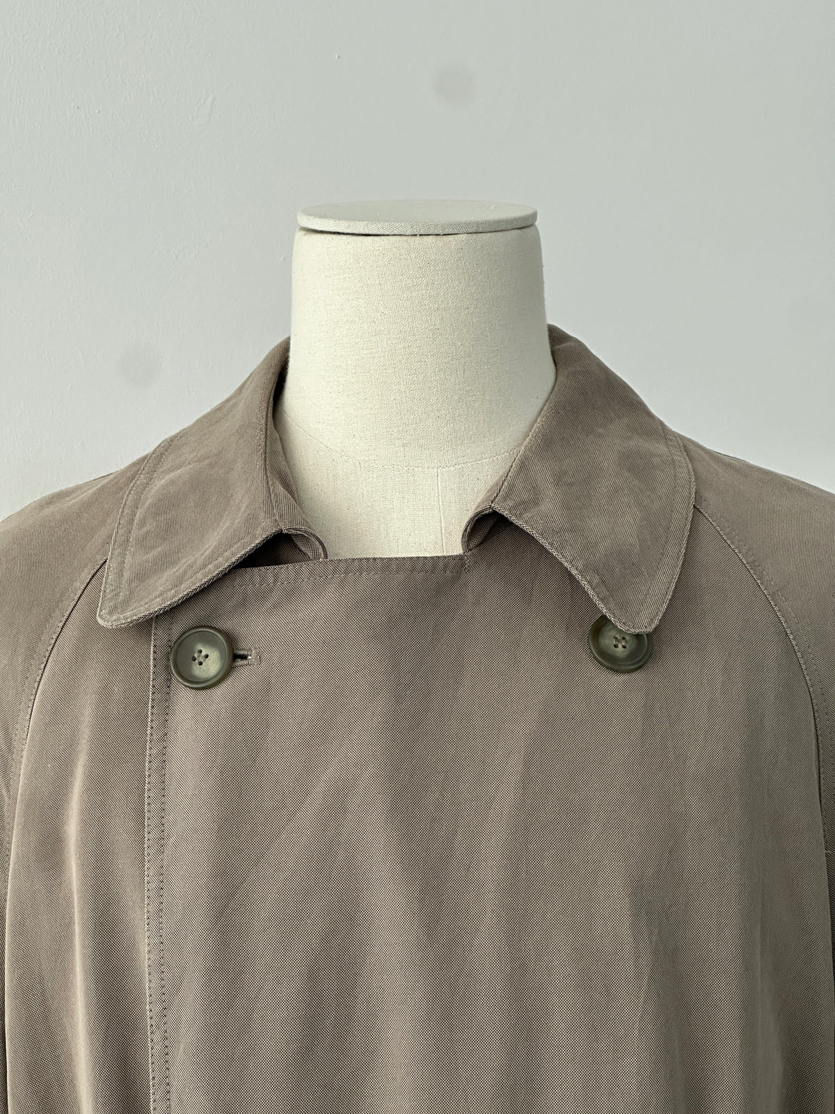 Ralph Lauren Chaps 1990s belted trench coat in XL-XXL, beige with classic collar and button details, displayed on a hanger.