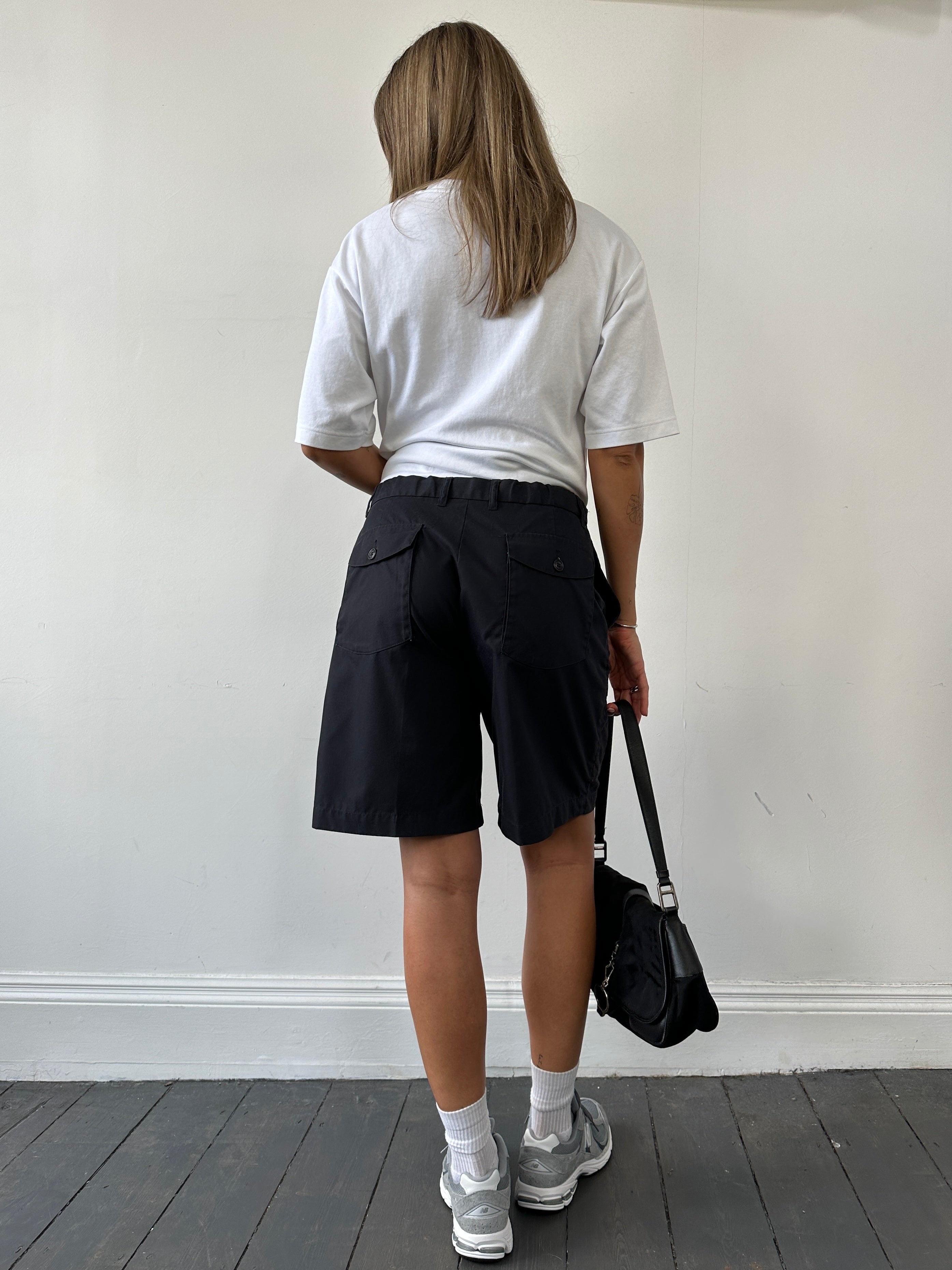 Vintage loose leg relaxed shorts in W32/34 laid flat, showing their casual denim style and vintage wash.