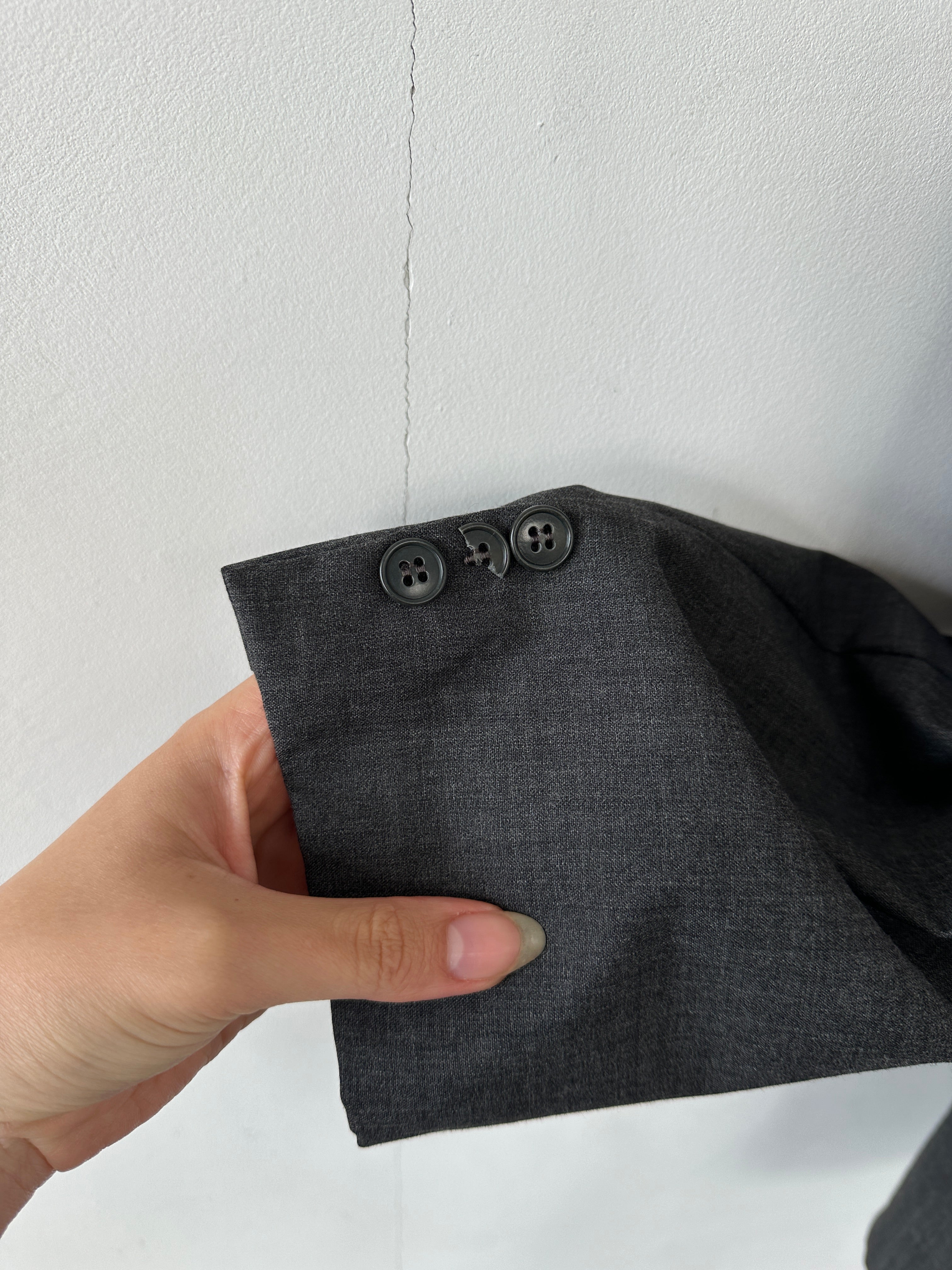 Giorgio Armani pure wool single-breasted blazer in size 42R/XL, tailored fit, classic lapel, dark navy color, front button closure.