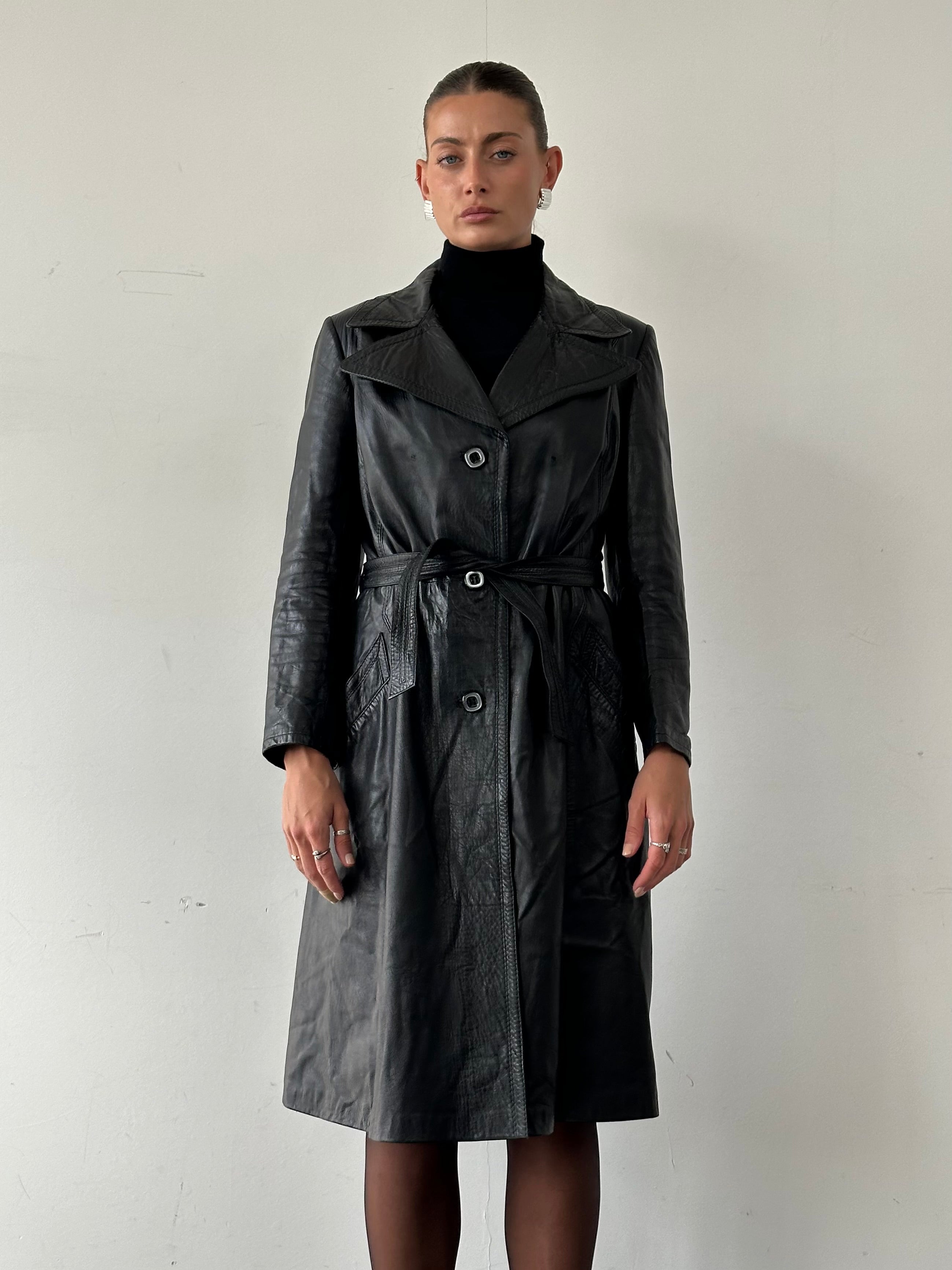 Vintage Italian leather belted trench coat in size M, stylish and classic outerwear with a vintage-inspired design.