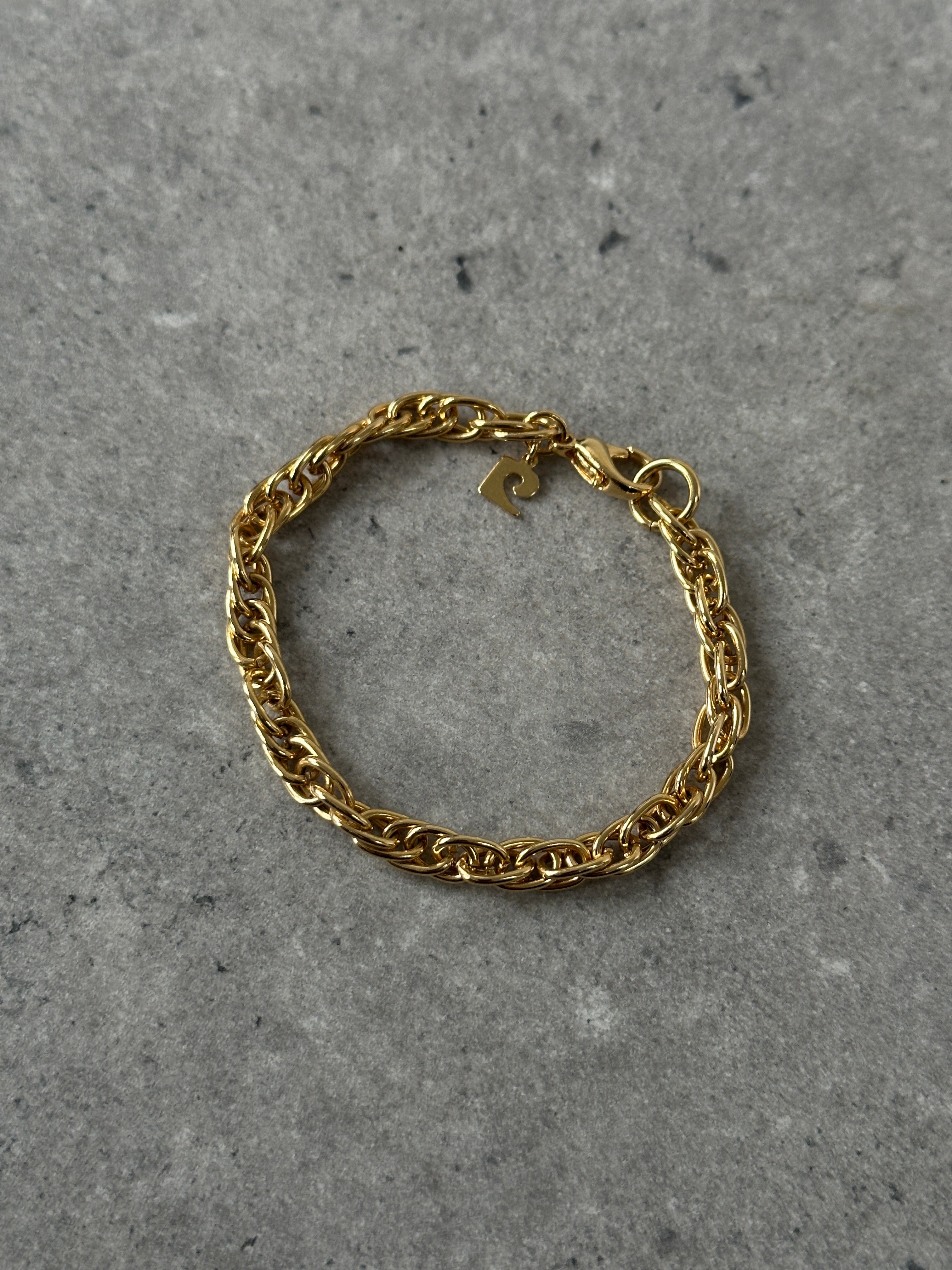 Gold plated Pierre Cardin bracelet with sleek design, featuring a shiny finish and elegant style for accessories.