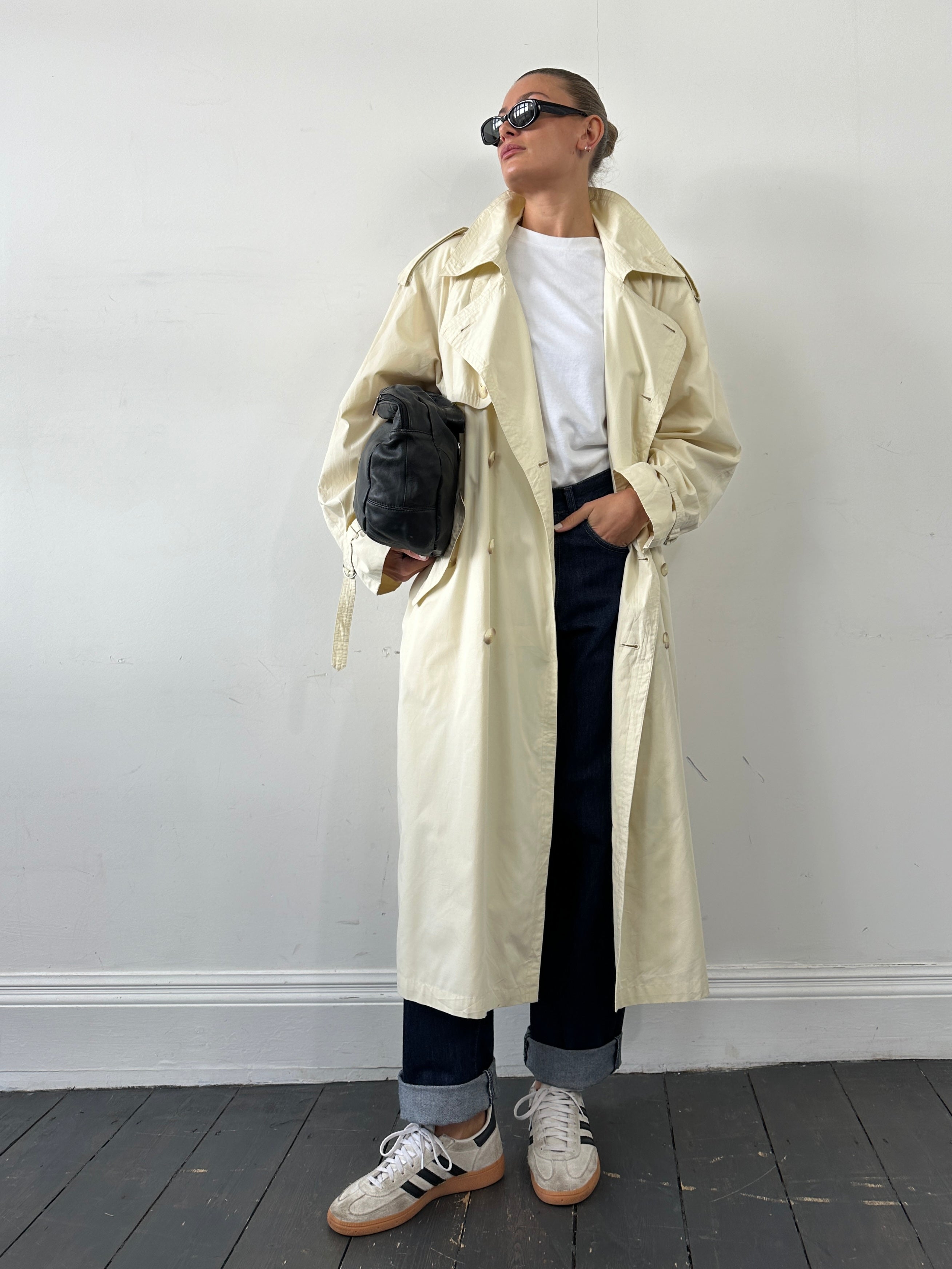 Yves Saint Laurent Pour Homme trench coat in XL/XXL, classic beige color, with wide collar and belted waist, stylish outerwear.