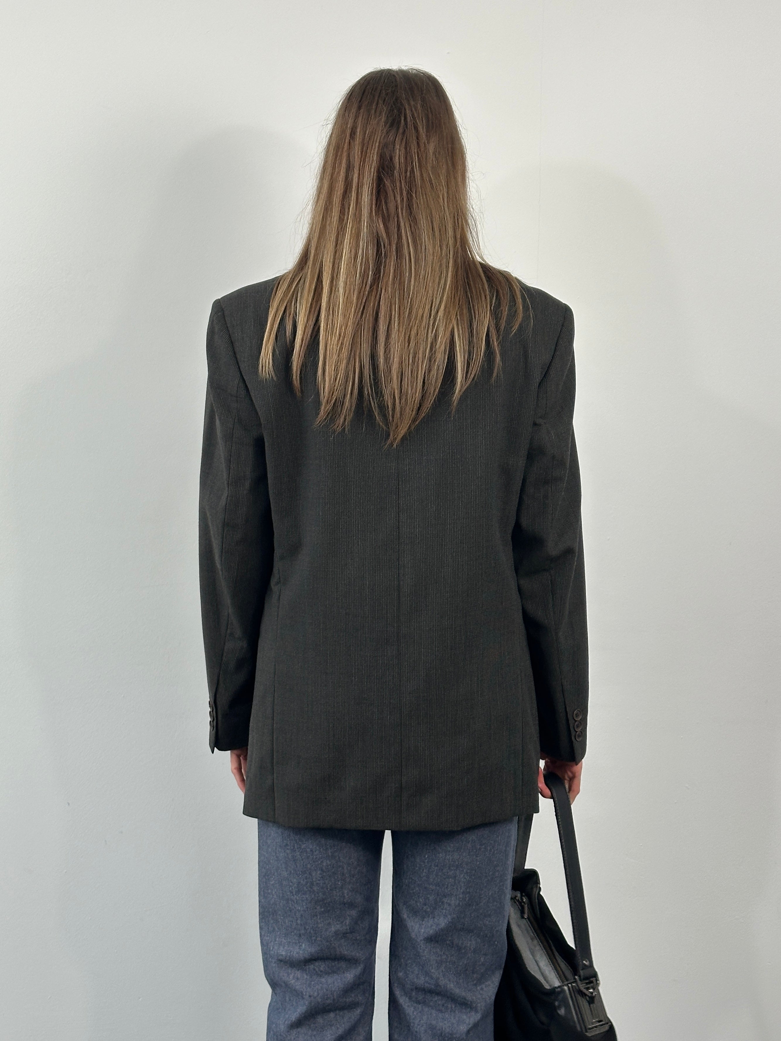 Yves Saint Laurent 1990s pure wool single-breasted blazer in size 40R/M, tailored fit with classic lapels and structured design.