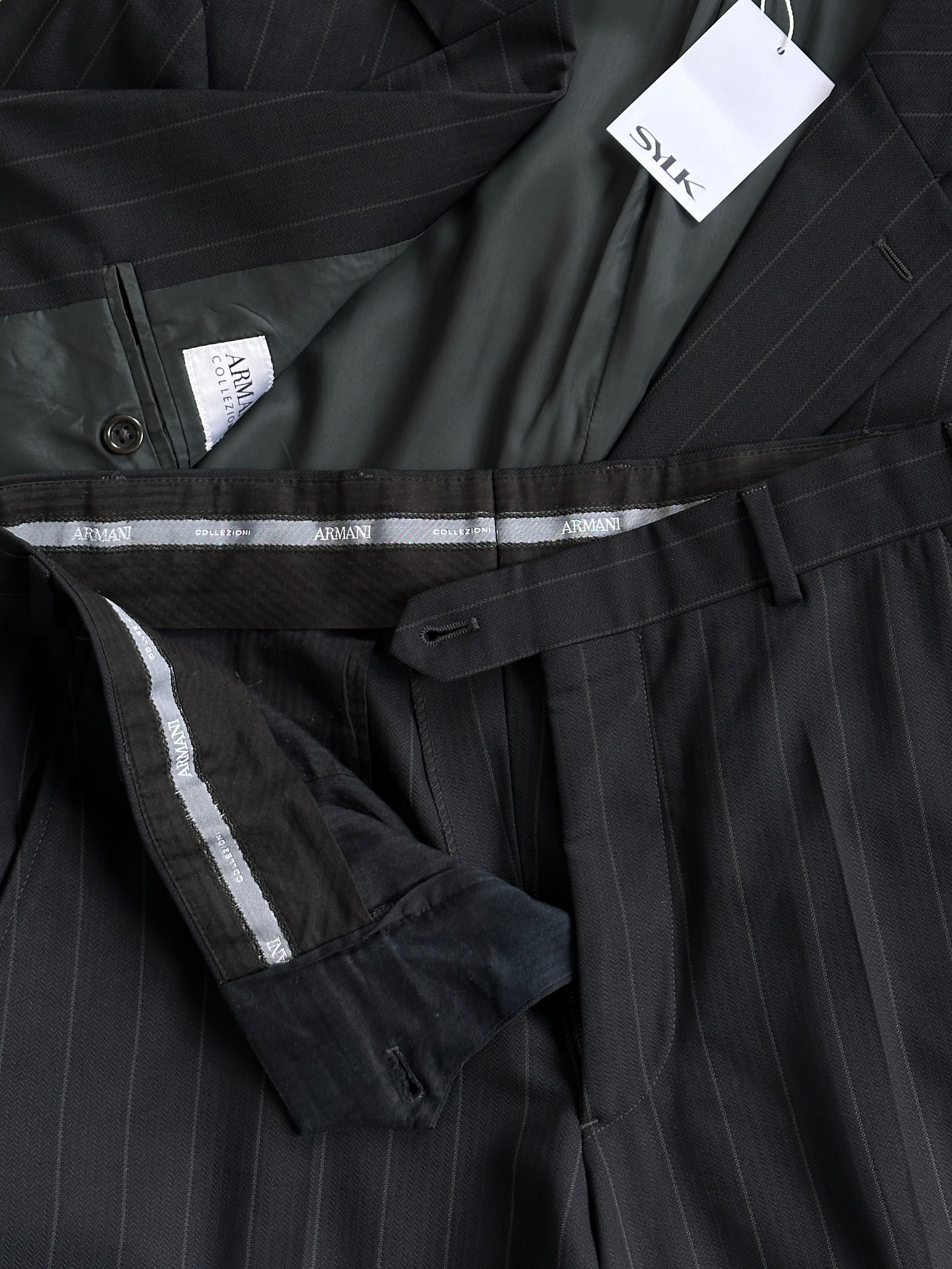 Armani Collezioni pinstripe wool single-breasted suit in size 38R/W32, featuring a classic tailored fit and lapel collar.