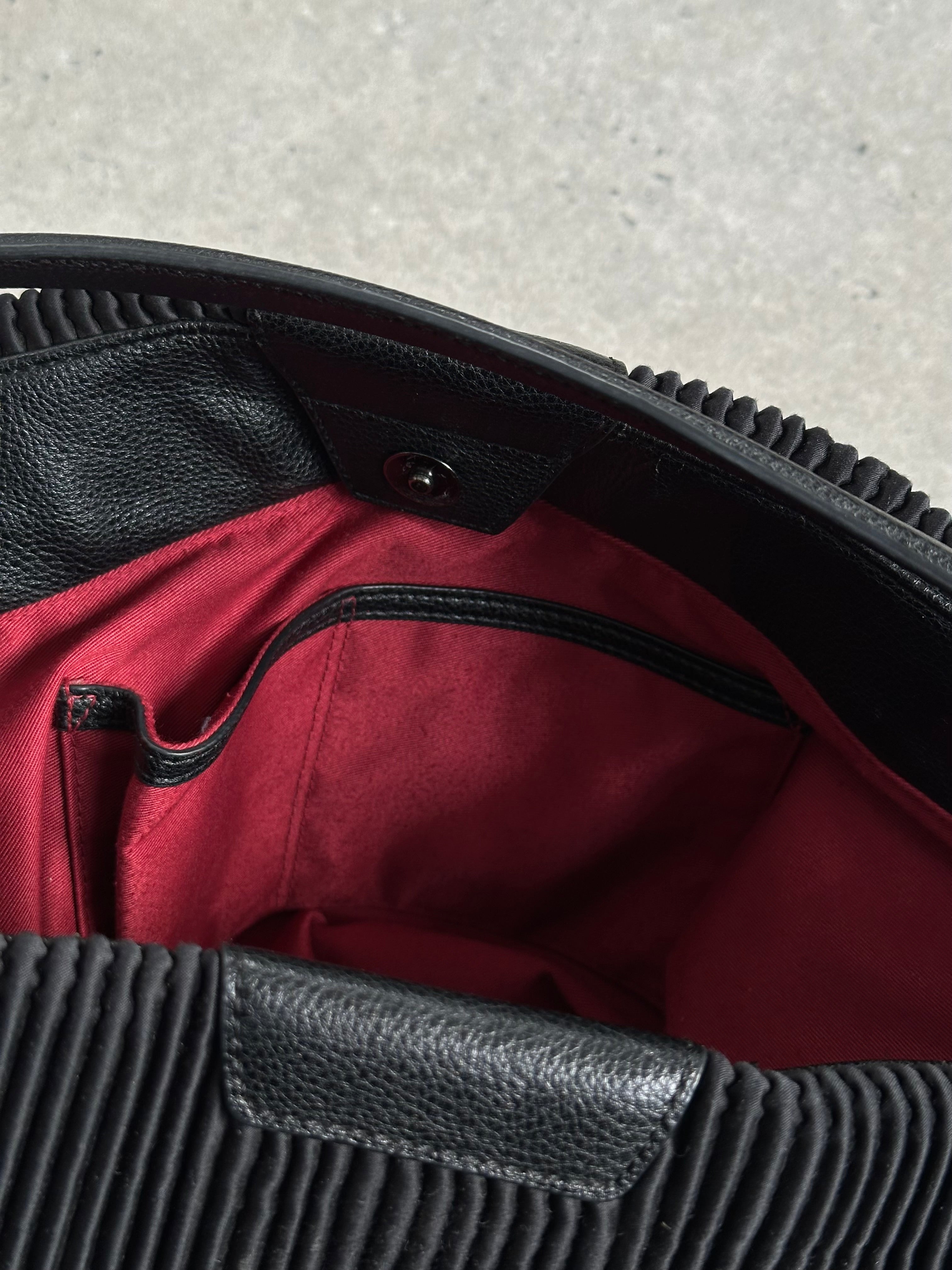 Emporio Armani pleated shoulder bag with sleek design, featuring a structured shape and elegant finish.