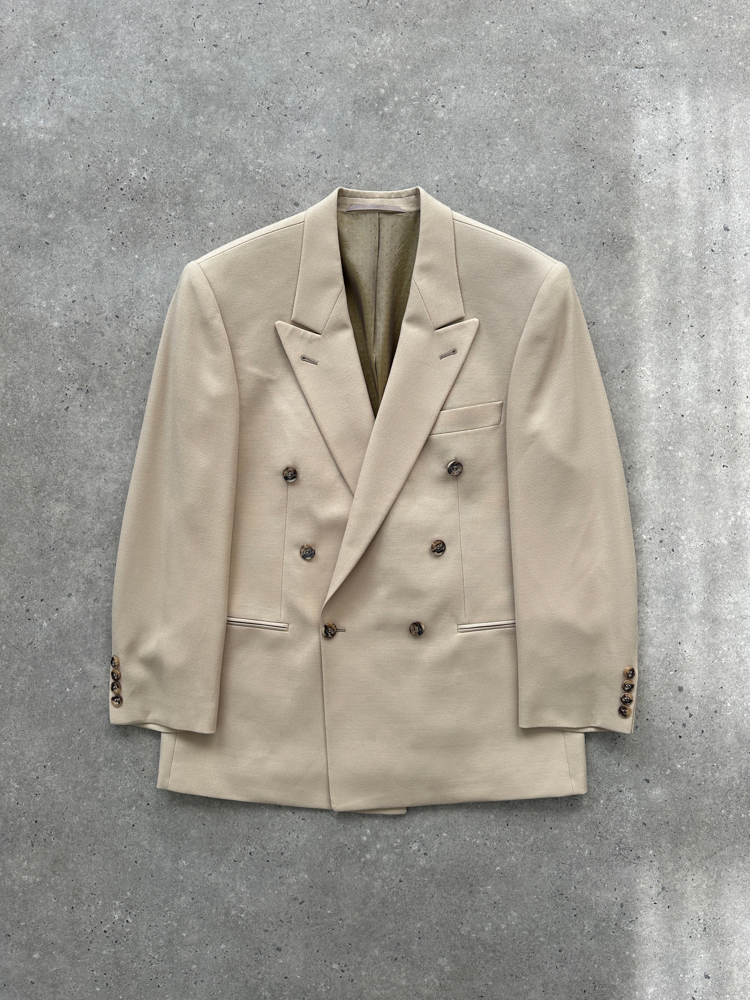 Vintage wool double-breasted blazer in size 40R/L, featuring classic lapels and tailored fit, displayed on a hanger.