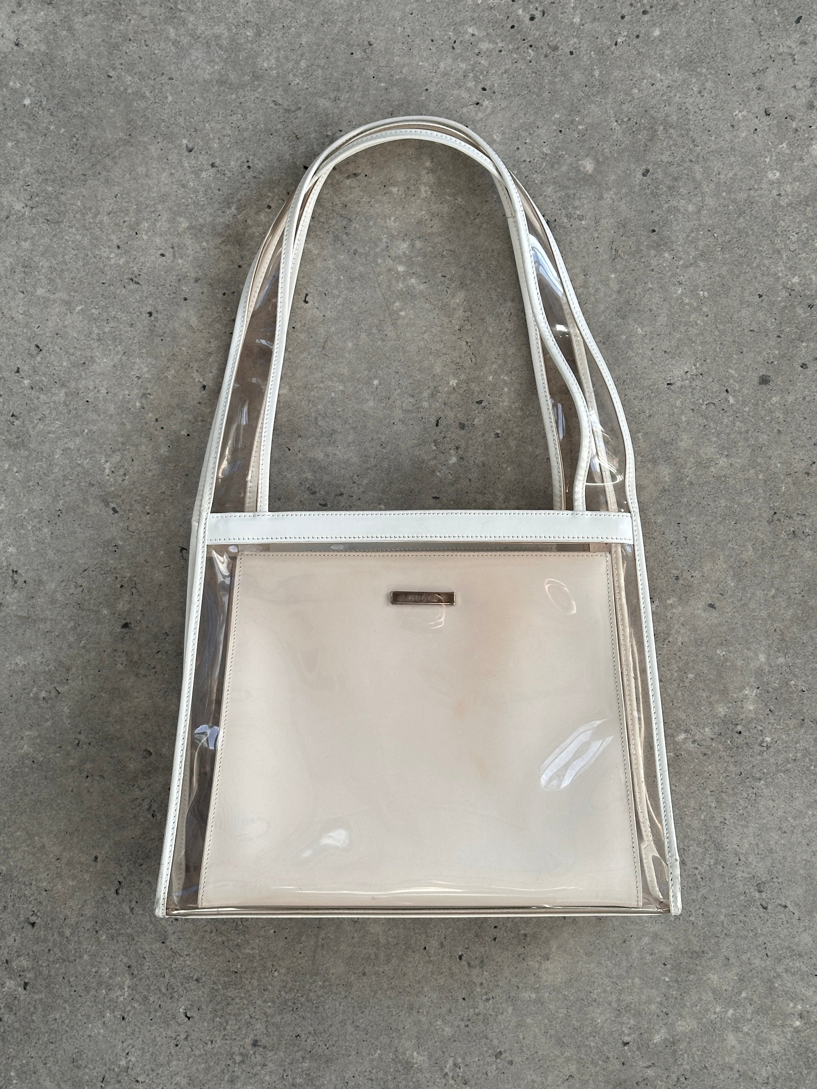Gucci 1990s Tom Ford 2-in-1 leather and vinyl shoulder bag with adjustable strap and classic Gucci logo detailing.
