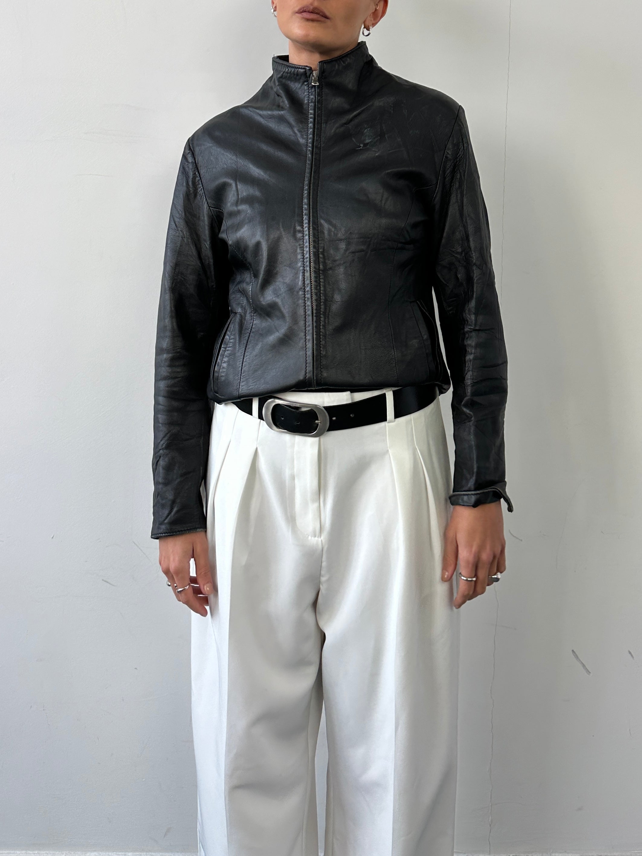 Vintage Italian leather jacket with high neck and double zip closure, size small, stylish vintage outerwear for women.