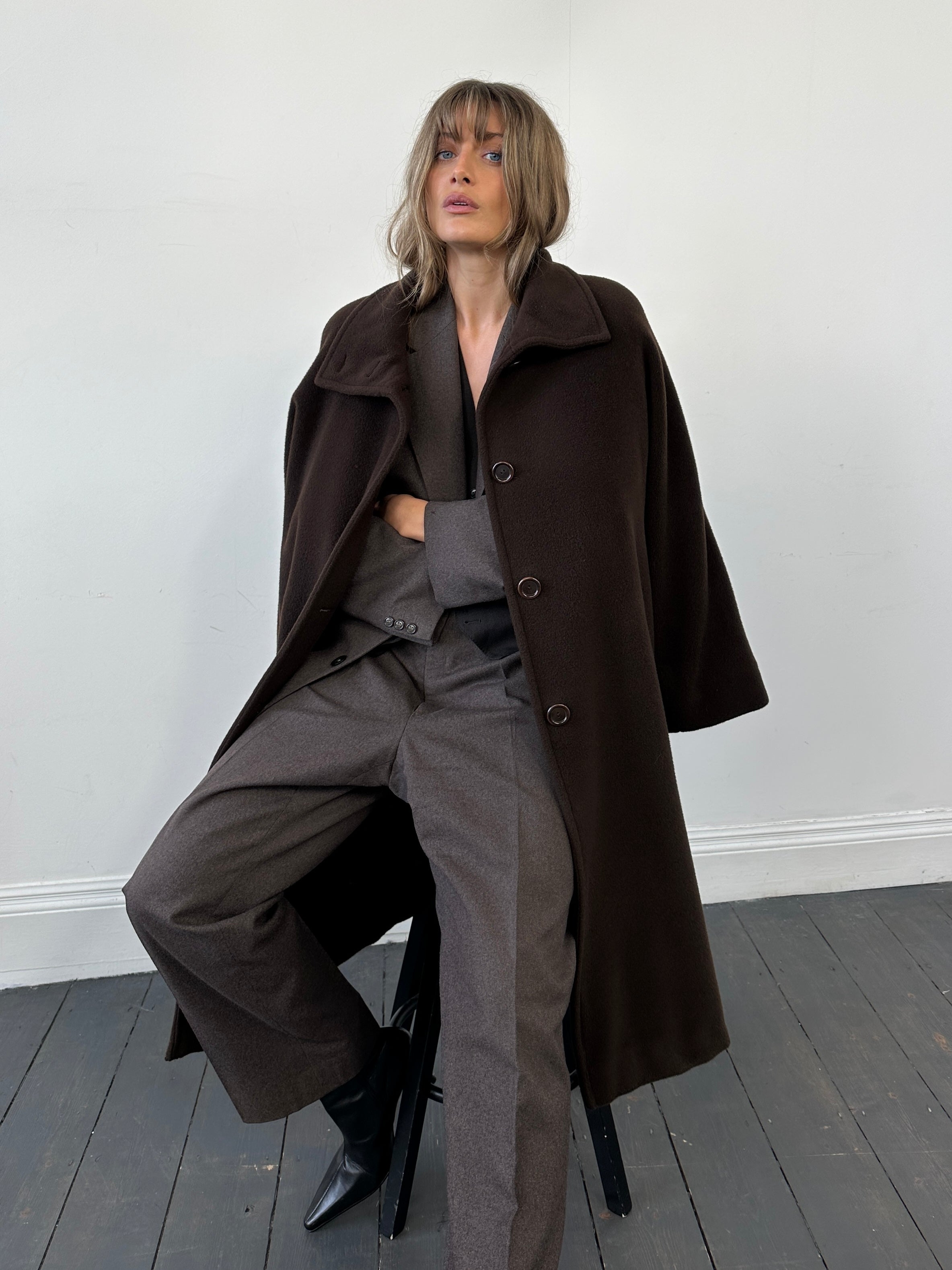 Christian Dior pure wool jumpsuit in size 46R/W34, tailored fit with classic design, displayed on a neutral background.