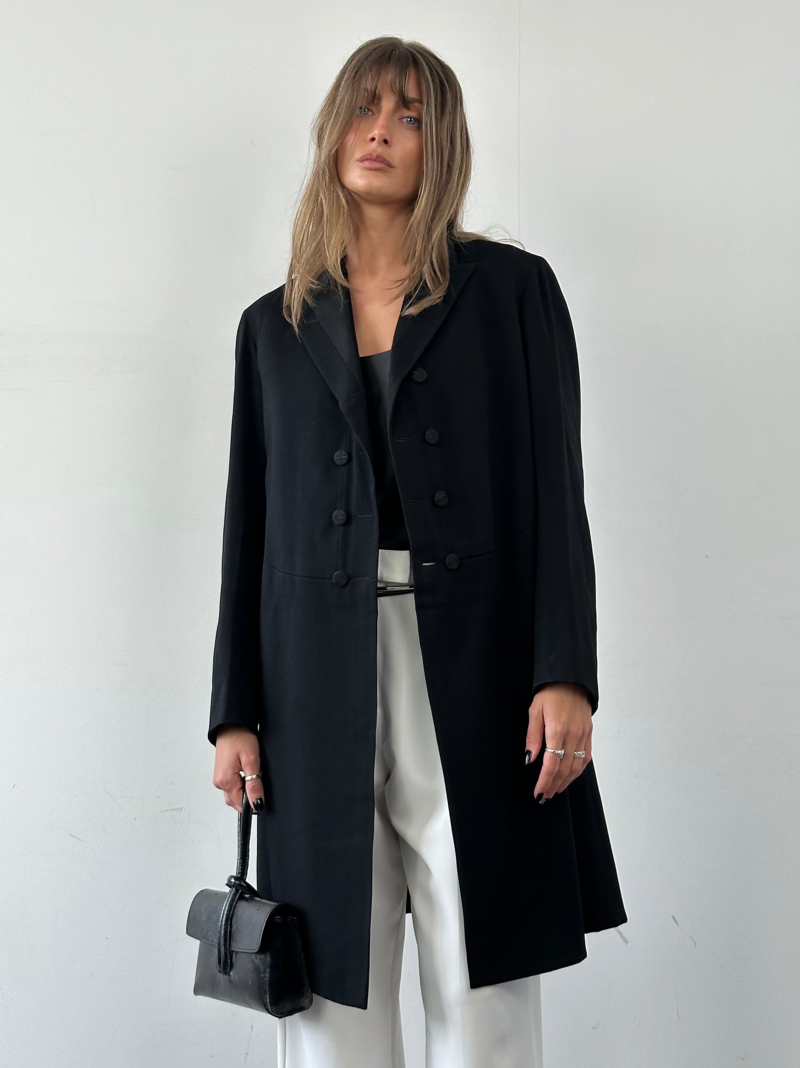 Vintage brand vintage tuxedo coat in size M/L, shown in a classic formal style with tailored lapels and button details.