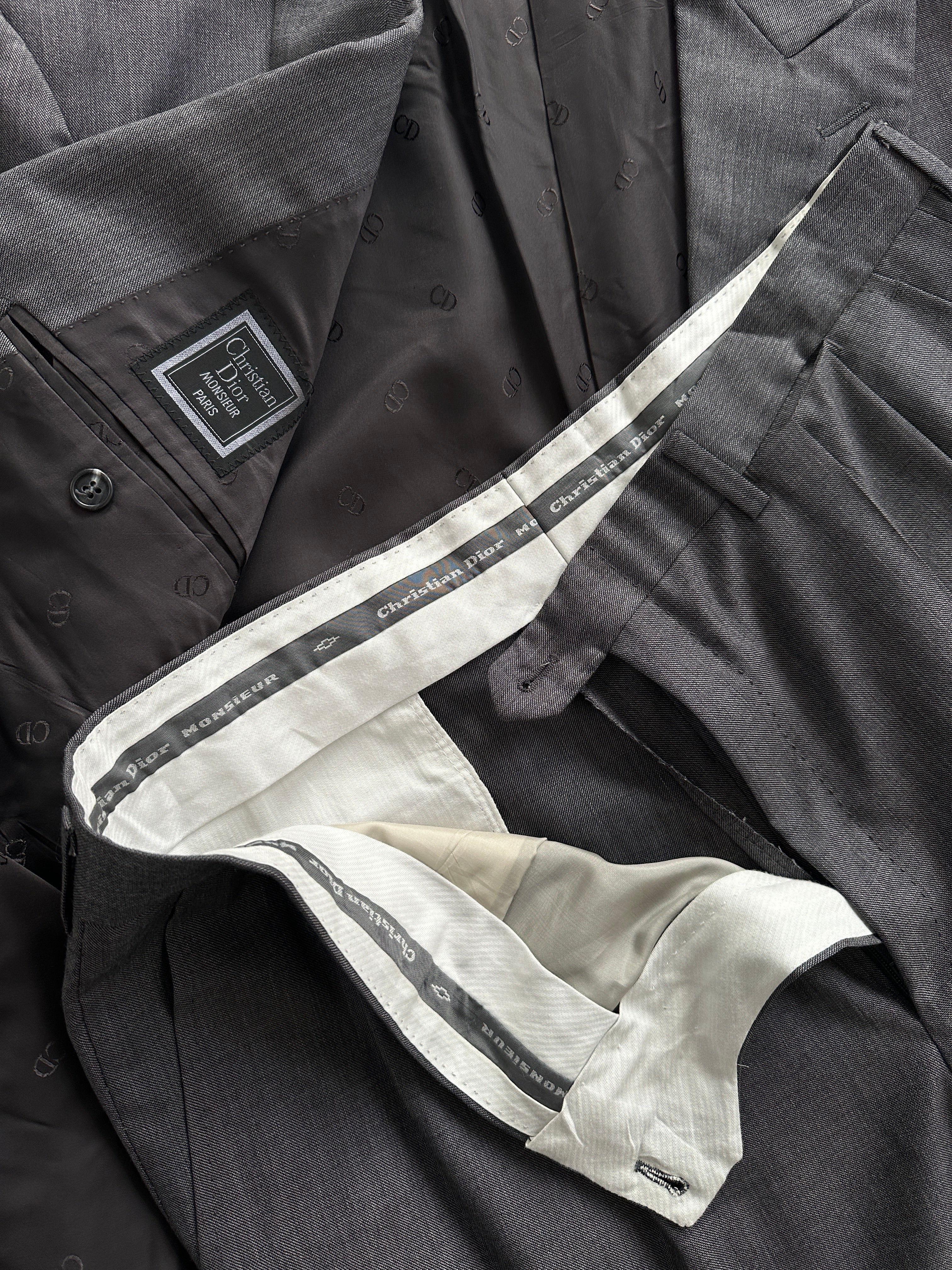 Christian Dior pure wool double-breasted suit jumpsuit in size 44S/W34, featuring tailored lapels and button details.