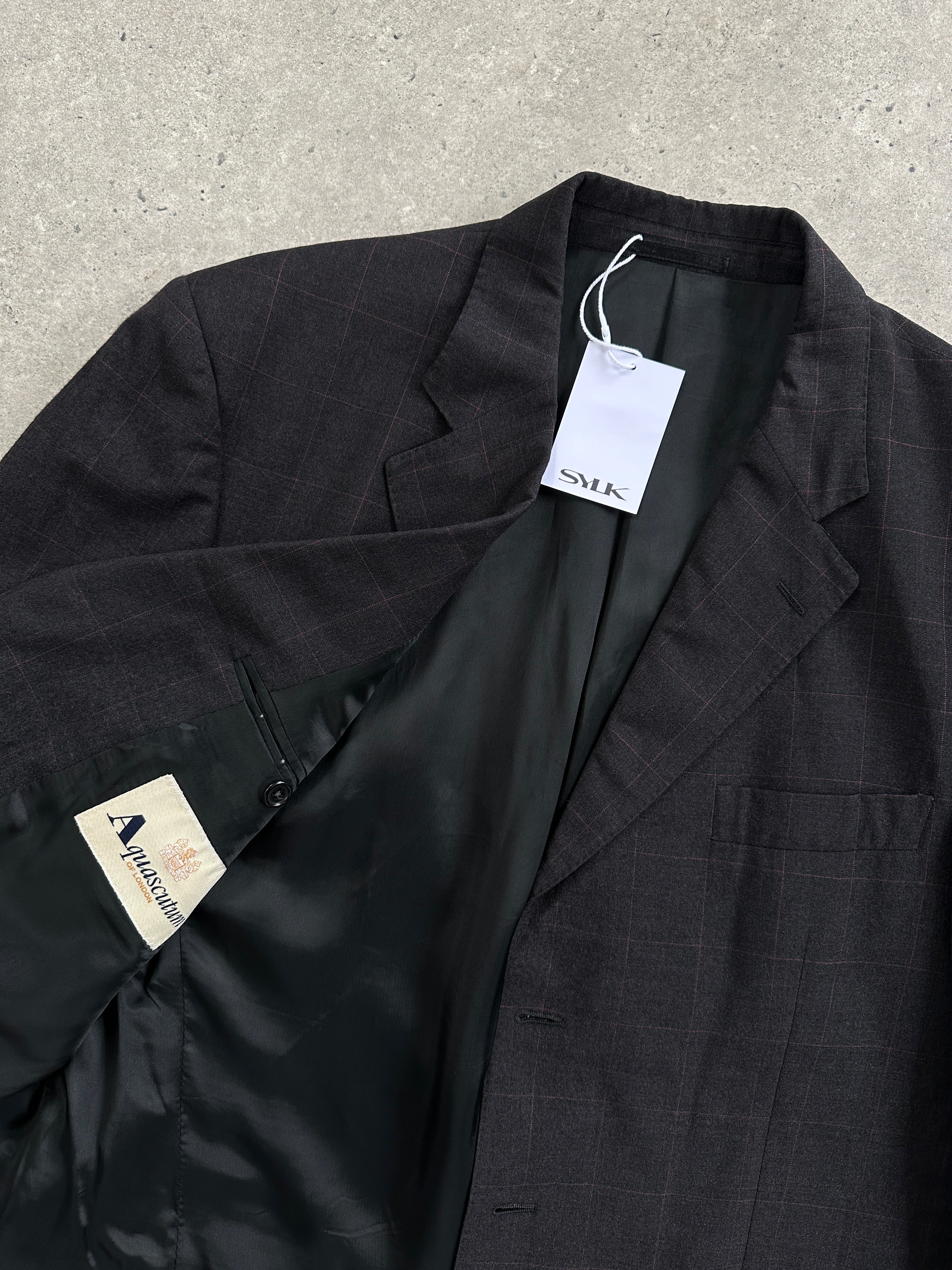 Aquascutum check pure wool single-breasted blazer in size 42L, tailored fit with classic plaid pattern and notch lapel.