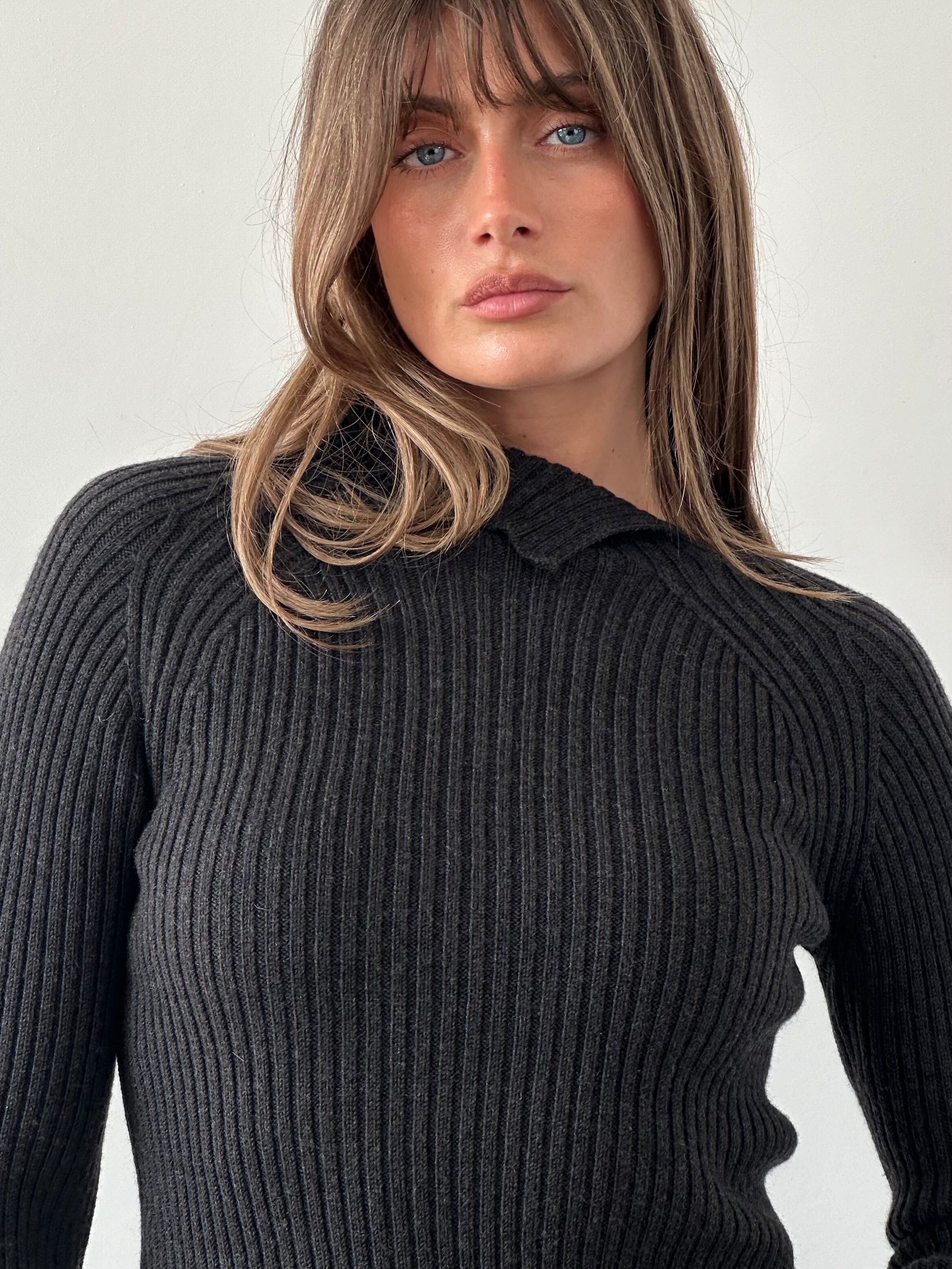 Max Mara pure wool asymmetric high neck knit jumper in a neutral color, showcasing its elegant design and high-quality fabric.