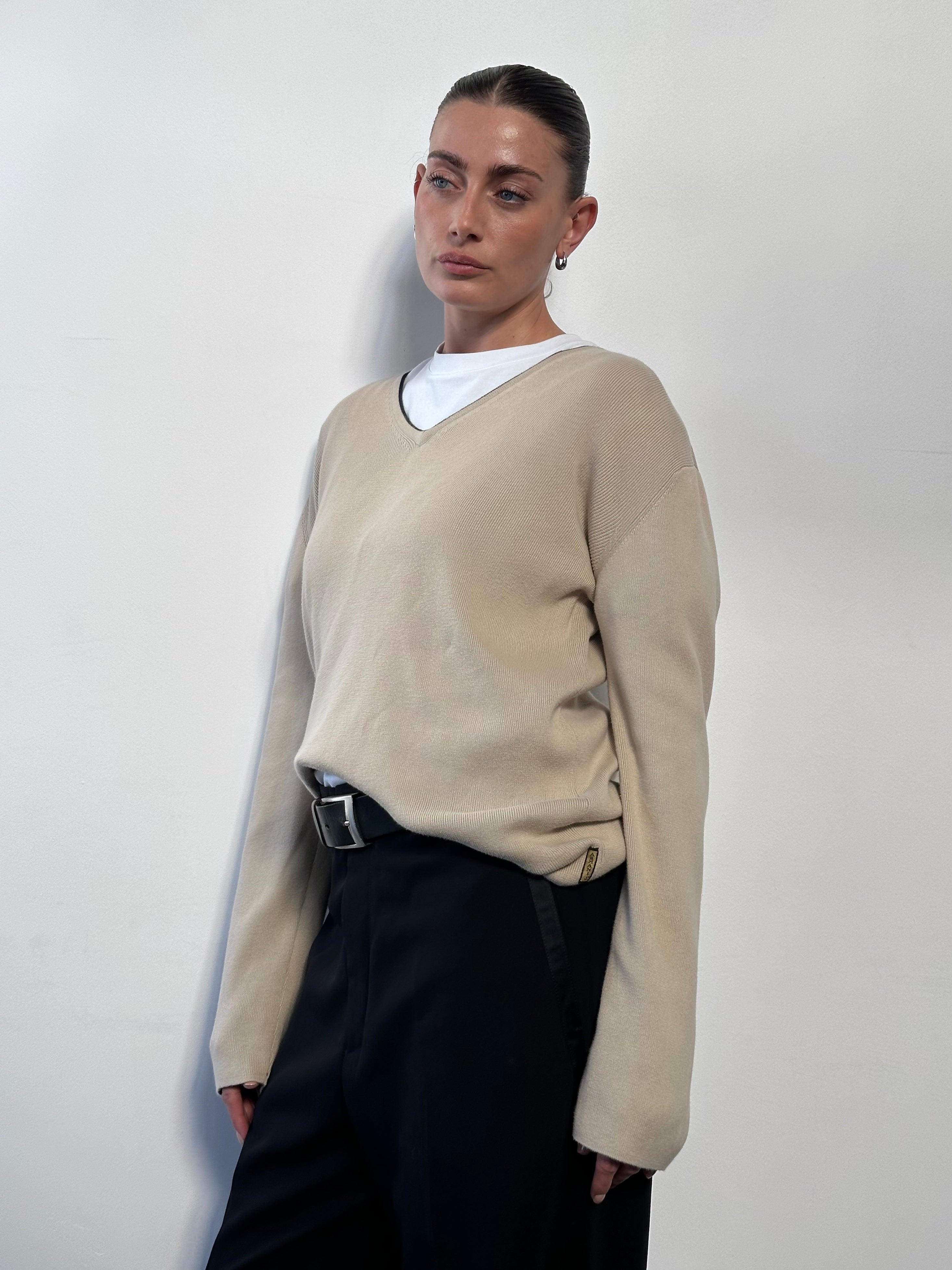 Armani Jeans pure cotton V-neck jumper in size L, featuring a classic fit and soft fabric, displayed on a neutral background.