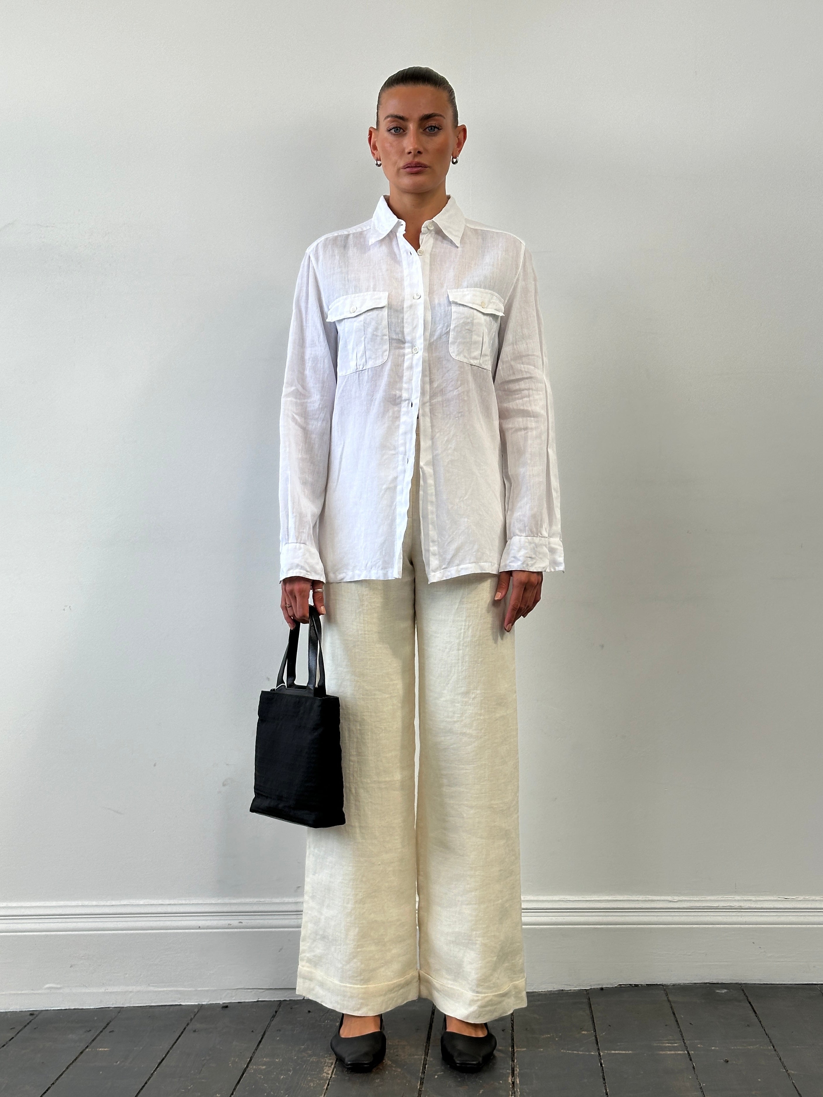Max Mara pure linen shirt in size M/L, lightweight and stylish, displayed on a hanger with a neutral background.