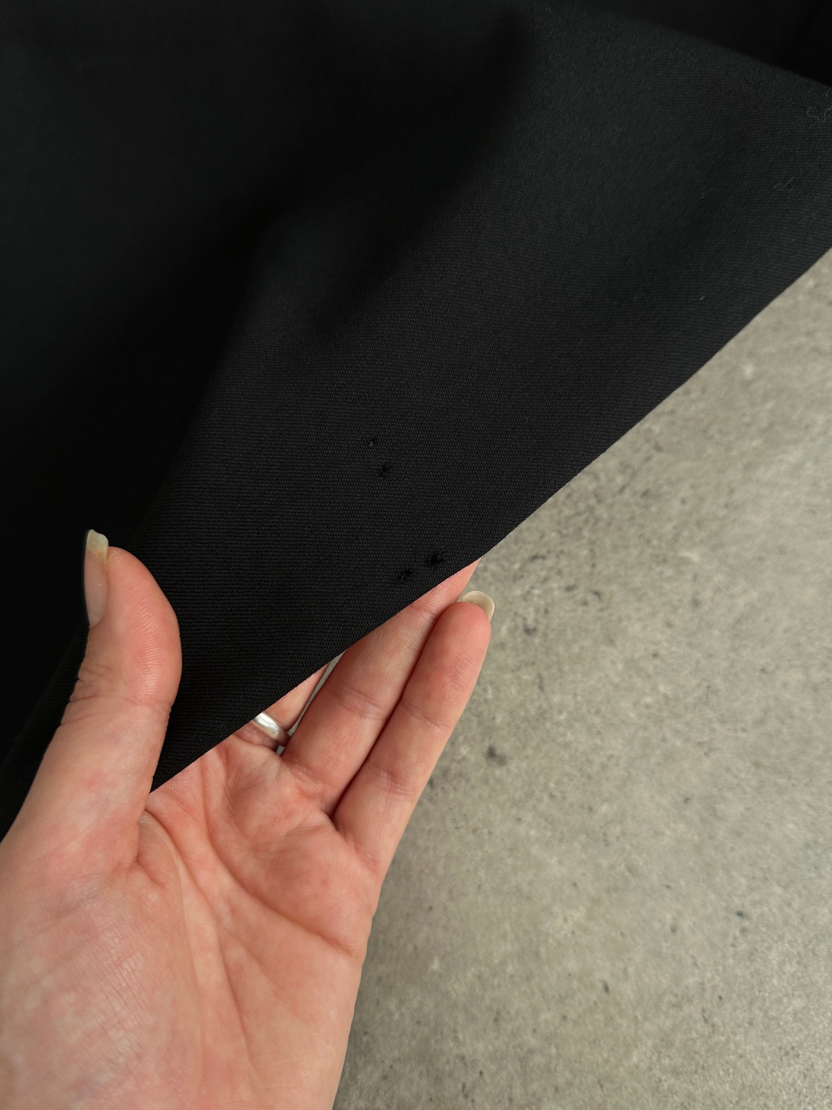 Yves Saint Laurent men's pure wool single-breasted suit in size 42R/W34, shown as a tailored jumpsuit with lapels and button closure.