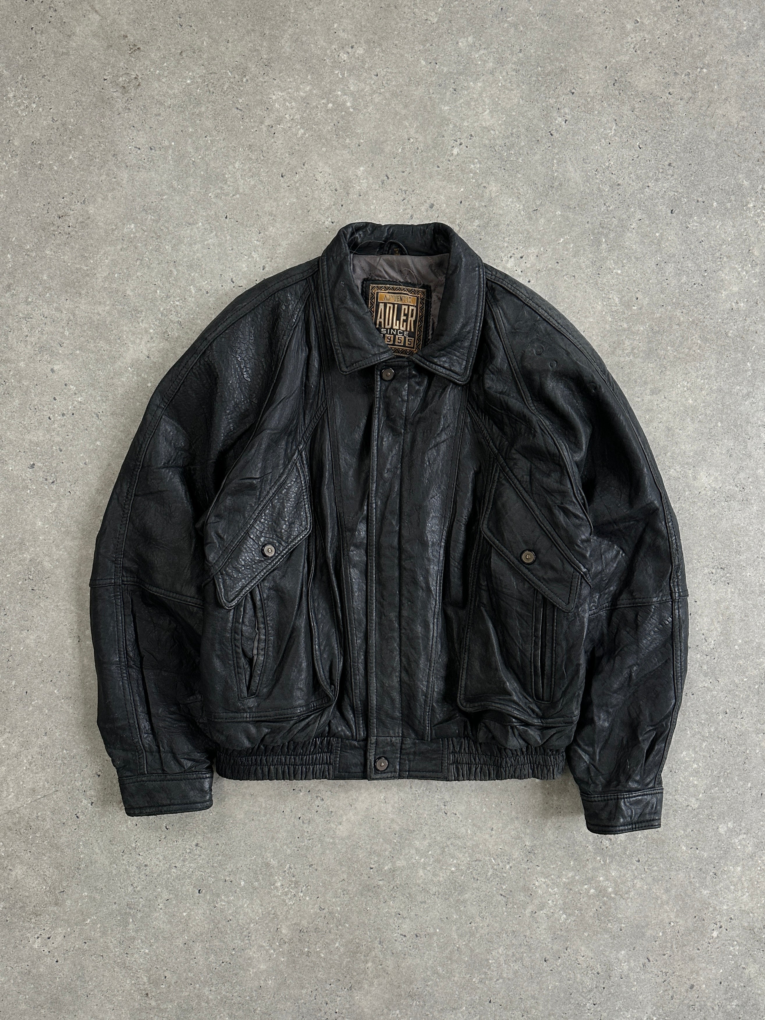 Vintage distressed leather bomber jacket in size L, featuring rugged style and classic design with visible worn details.