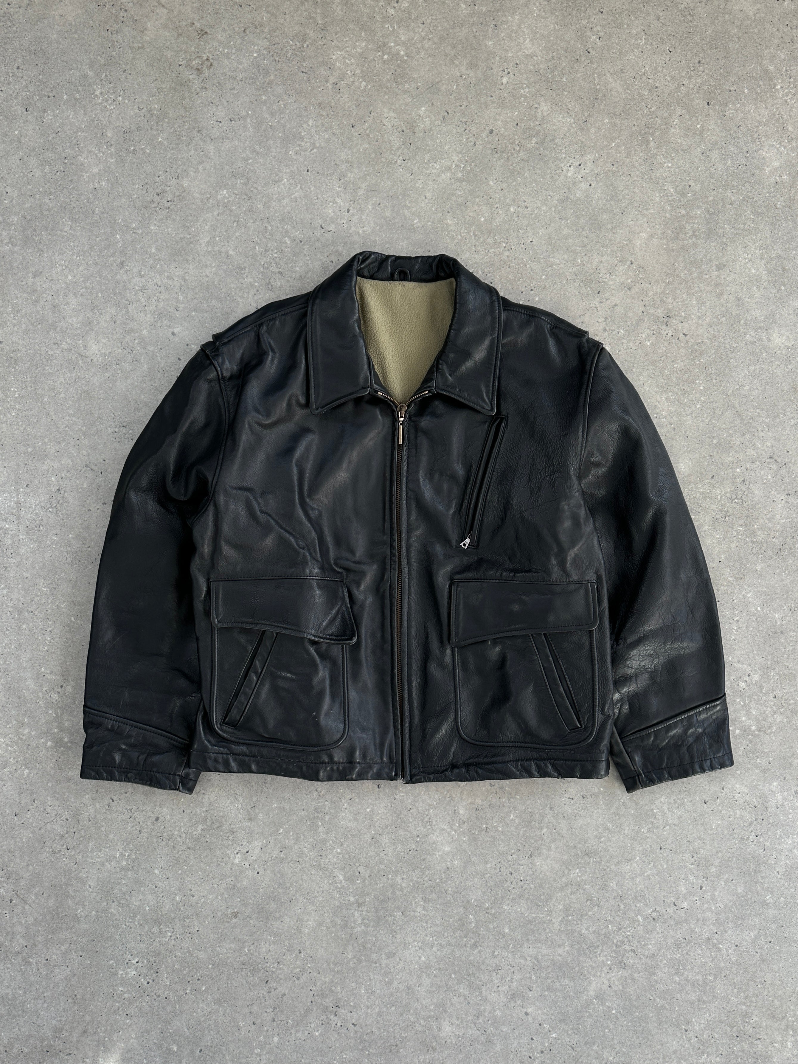 Vintage fleece-lined leather jacket in XL, showcasing classic design with quilted interior and sturdy leather exterior.
