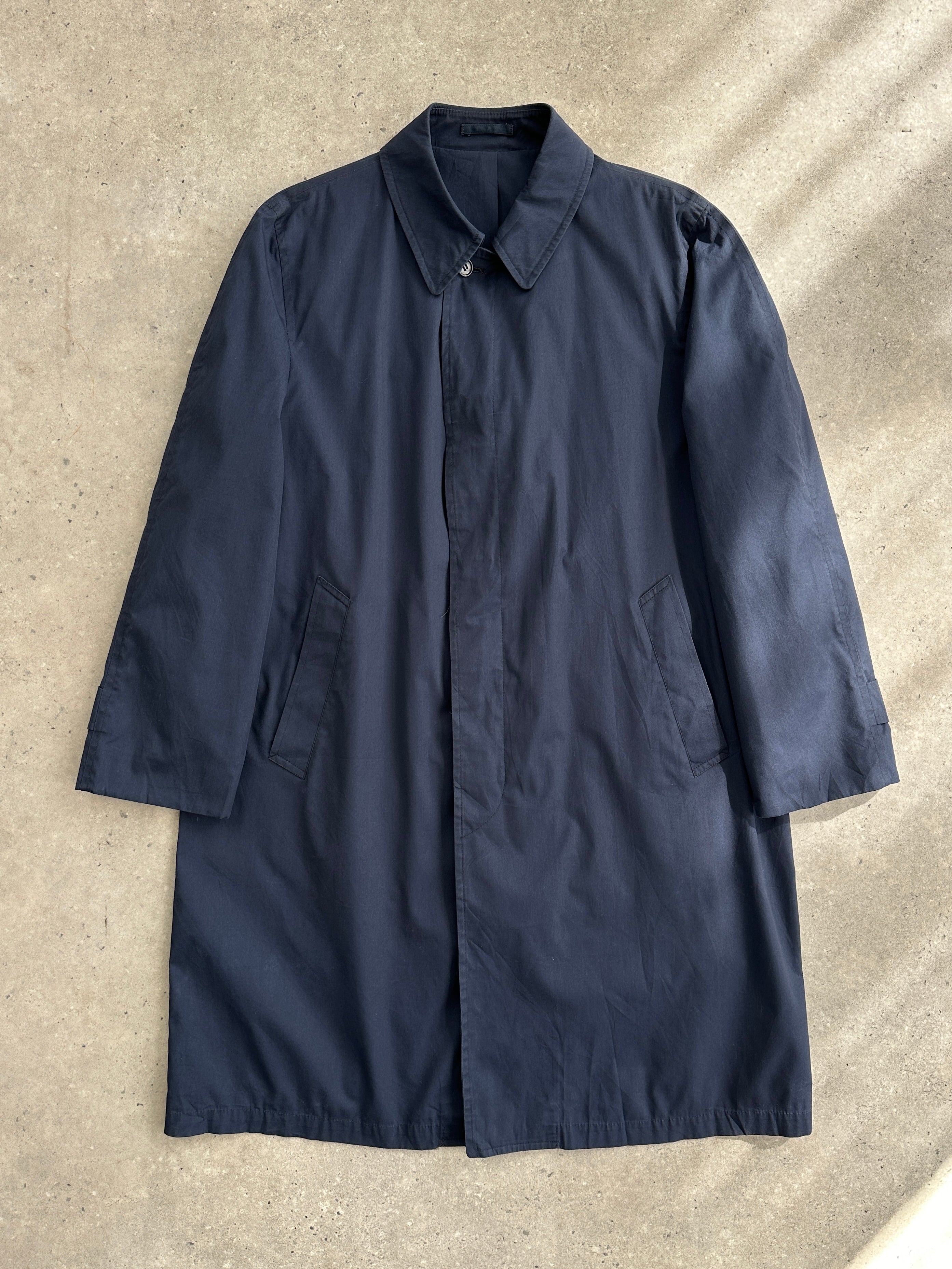 London Fog concealed placket trench coat in XL, showing classic beige design, double-breasted style, and belted waist.