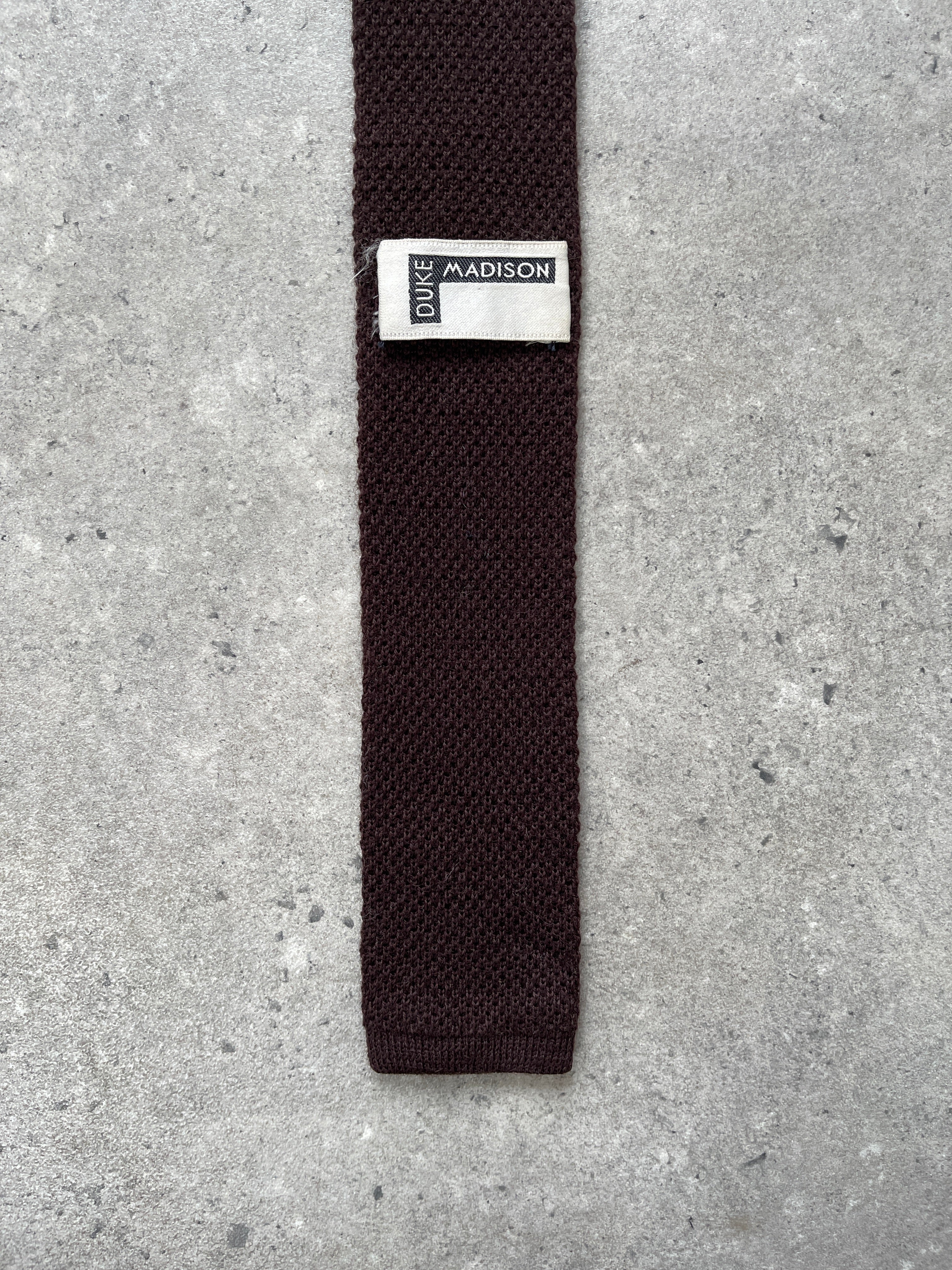 Vintage 1990s Japanese pure wool knitted tie with intricate pattern and rich texture, showcasing classic craftsmanship.