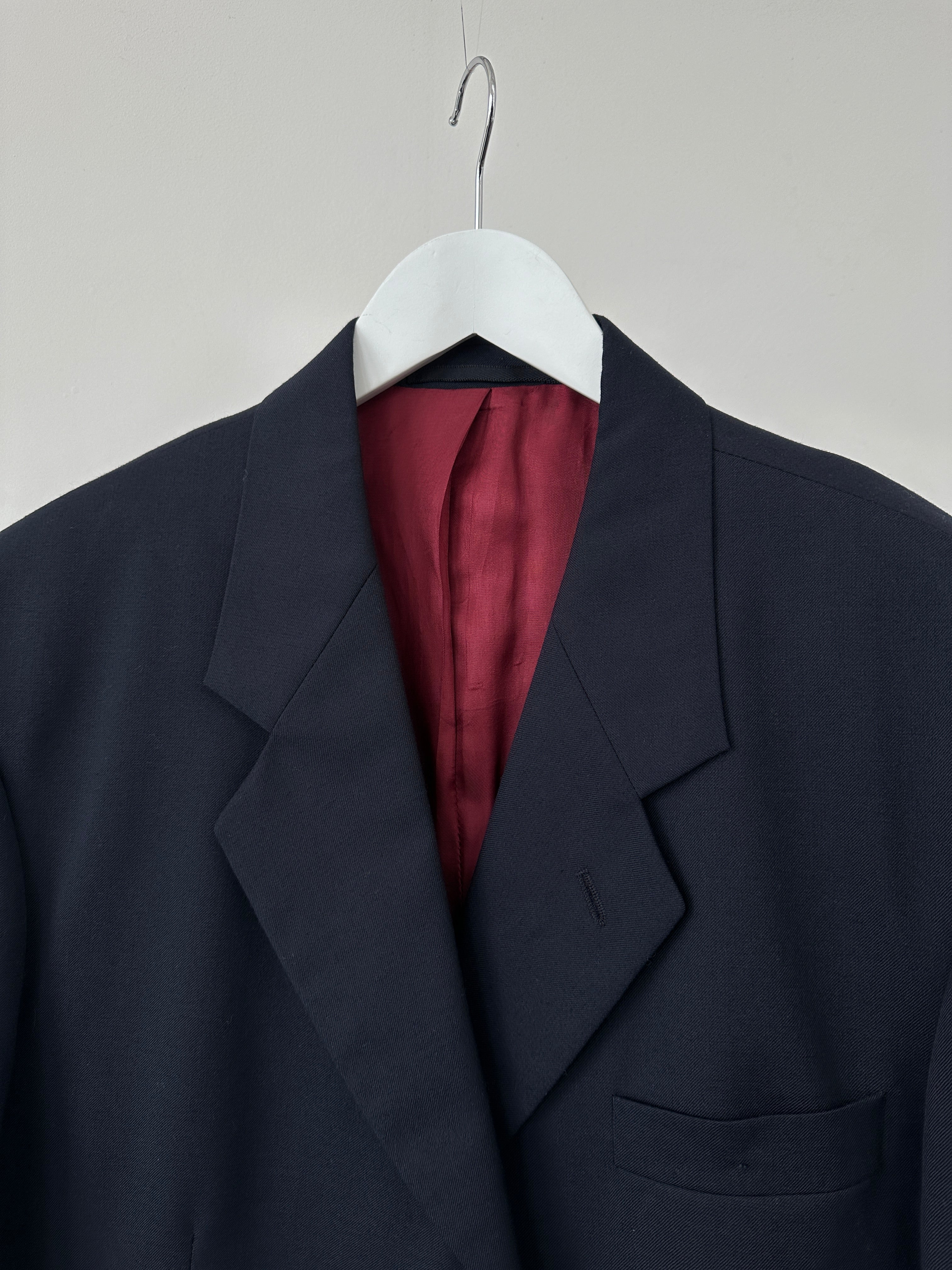 Vintage wool boxy single-breasted blazer in size 42R/XL, featuring classic tailoring and a timeless design.
