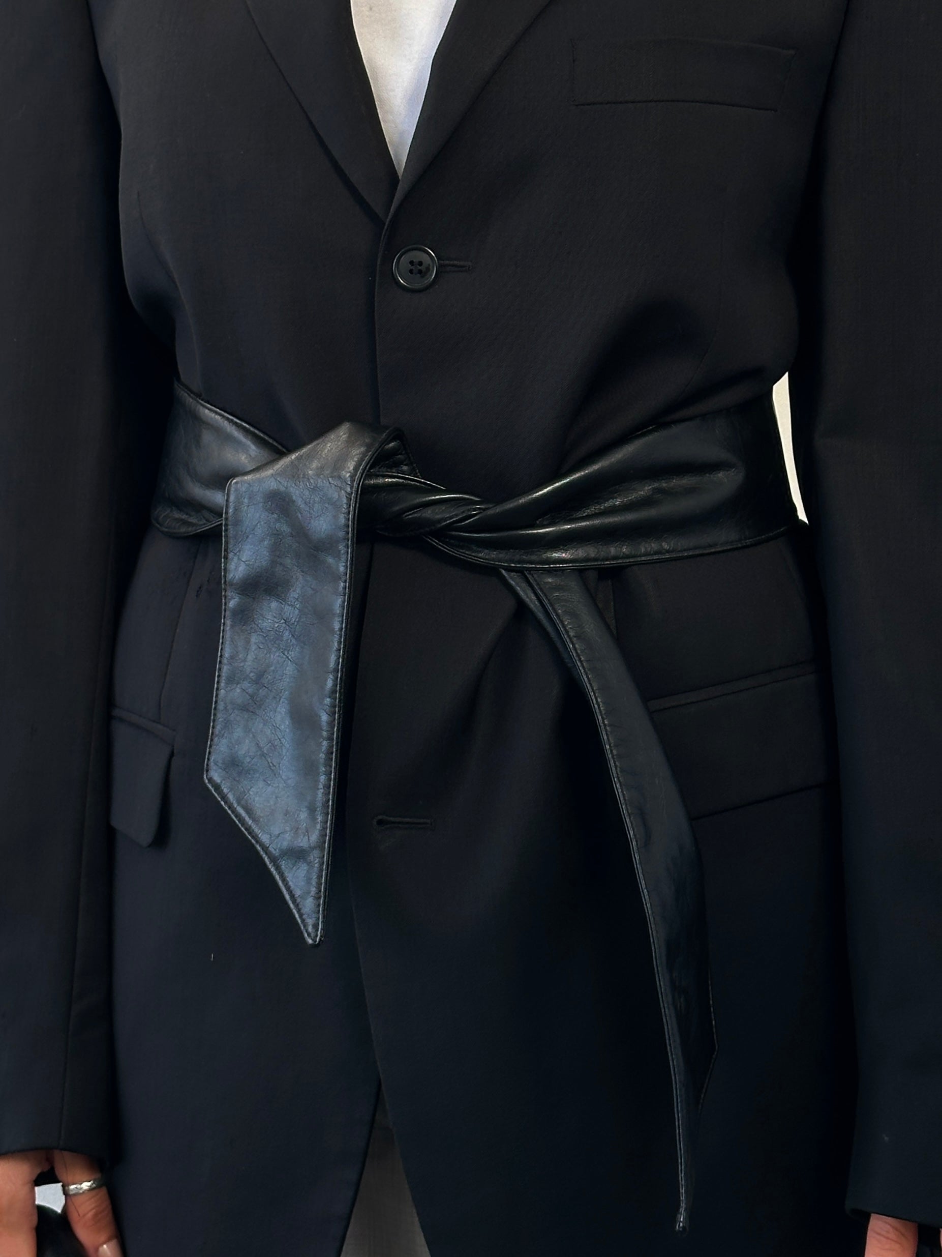 Vintage 1990s faux leather tie belt, one size, with a classic design and adjustable length, featuring a smooth leather finish.