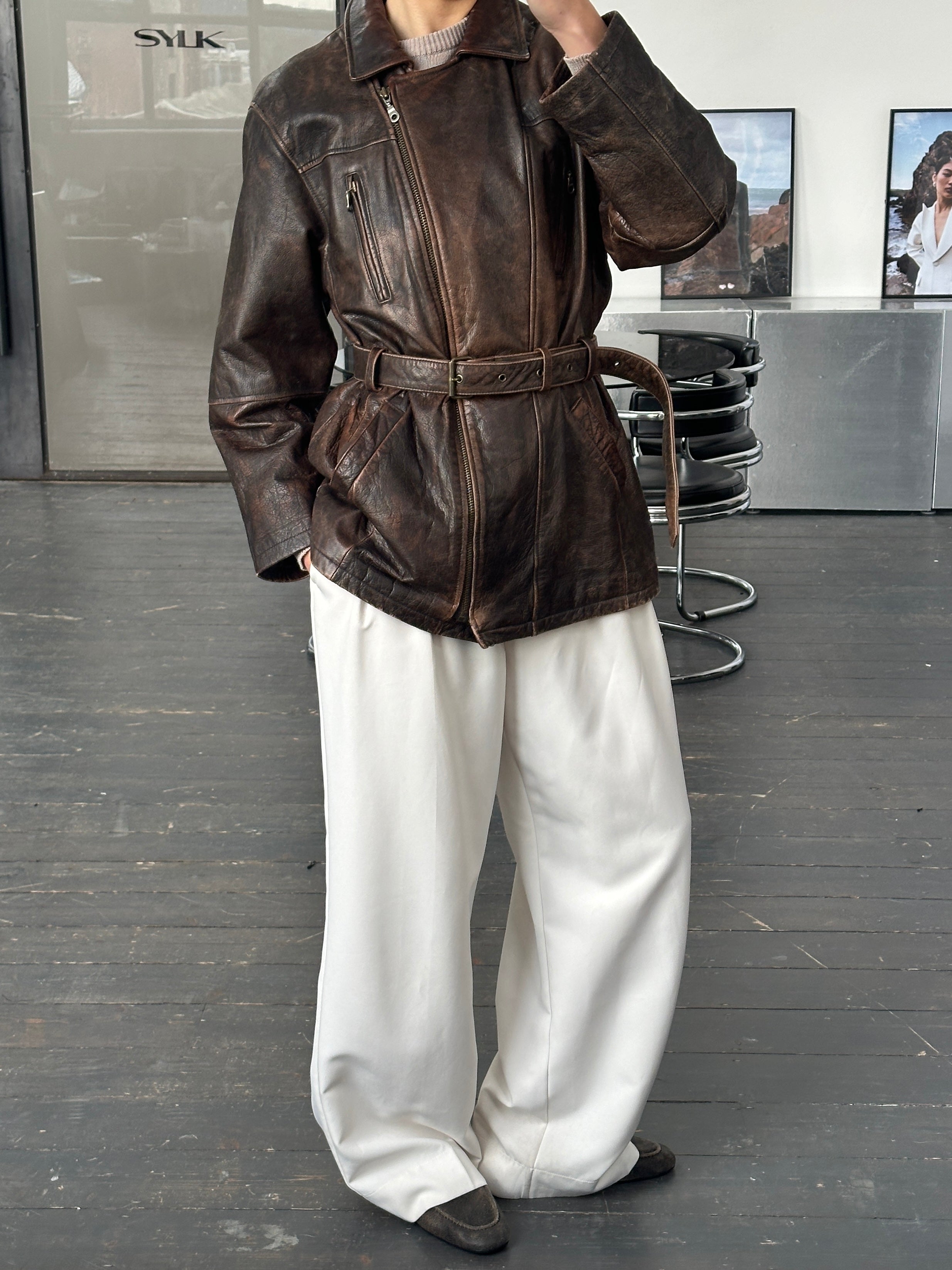 Vintage 1980s belted leather jacket in aged brown leather, size large, with classic collar and button details.