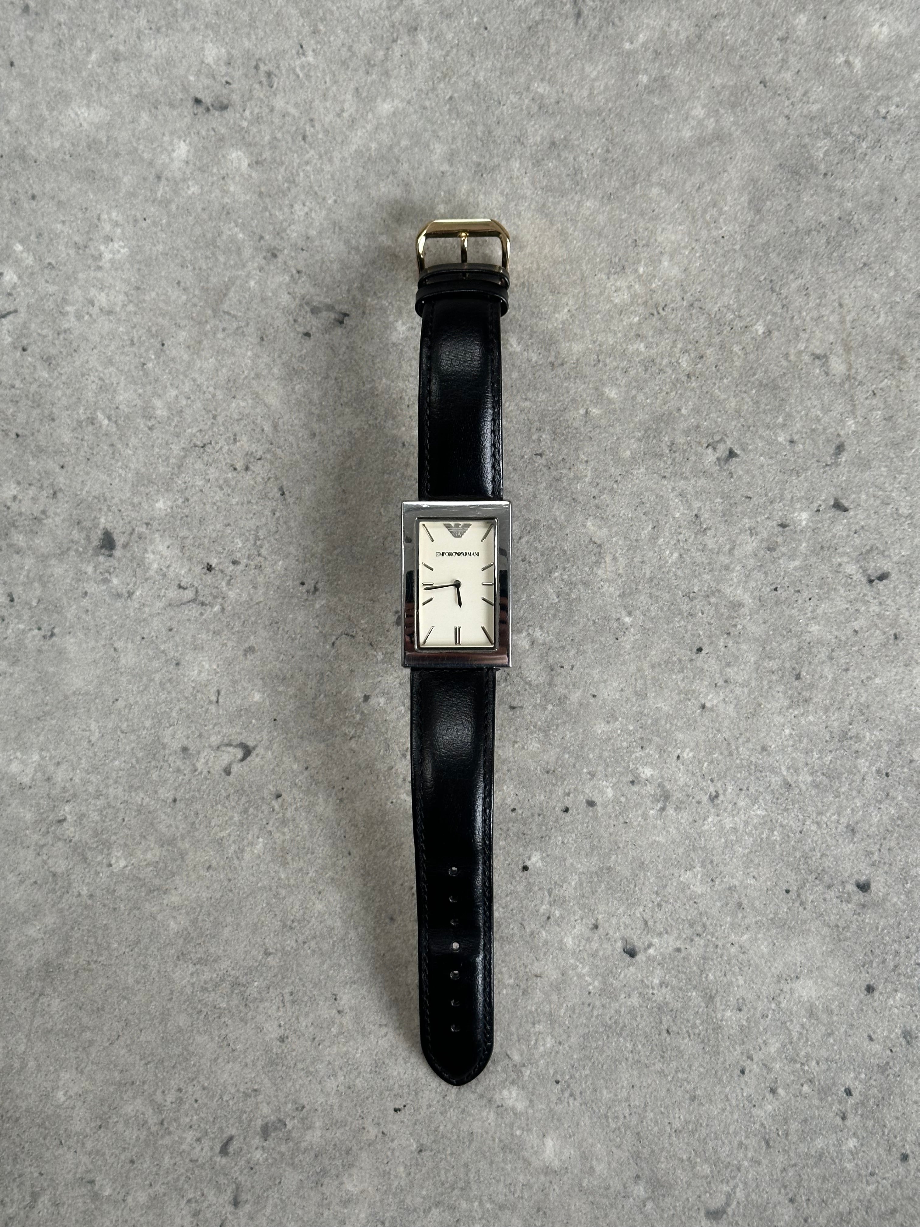 Emporio Armani 2000s stainless steel rectangle leather watch with silver dial and black leather strap.