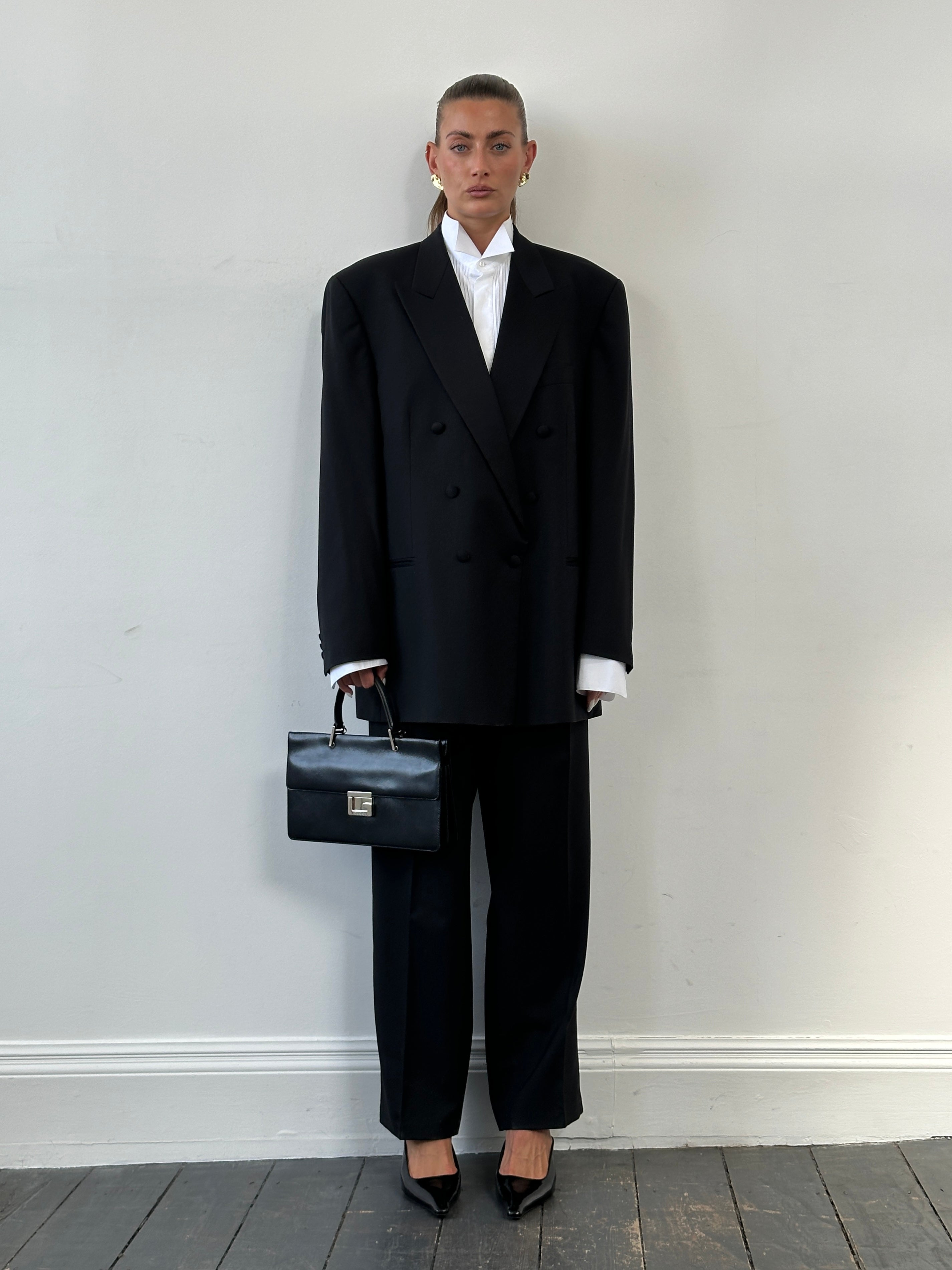 Vintage 1990s pure wool double-breasted tuxedo suit, size 46R/W34-36, featuring classic tailored design and sleek lapels.
