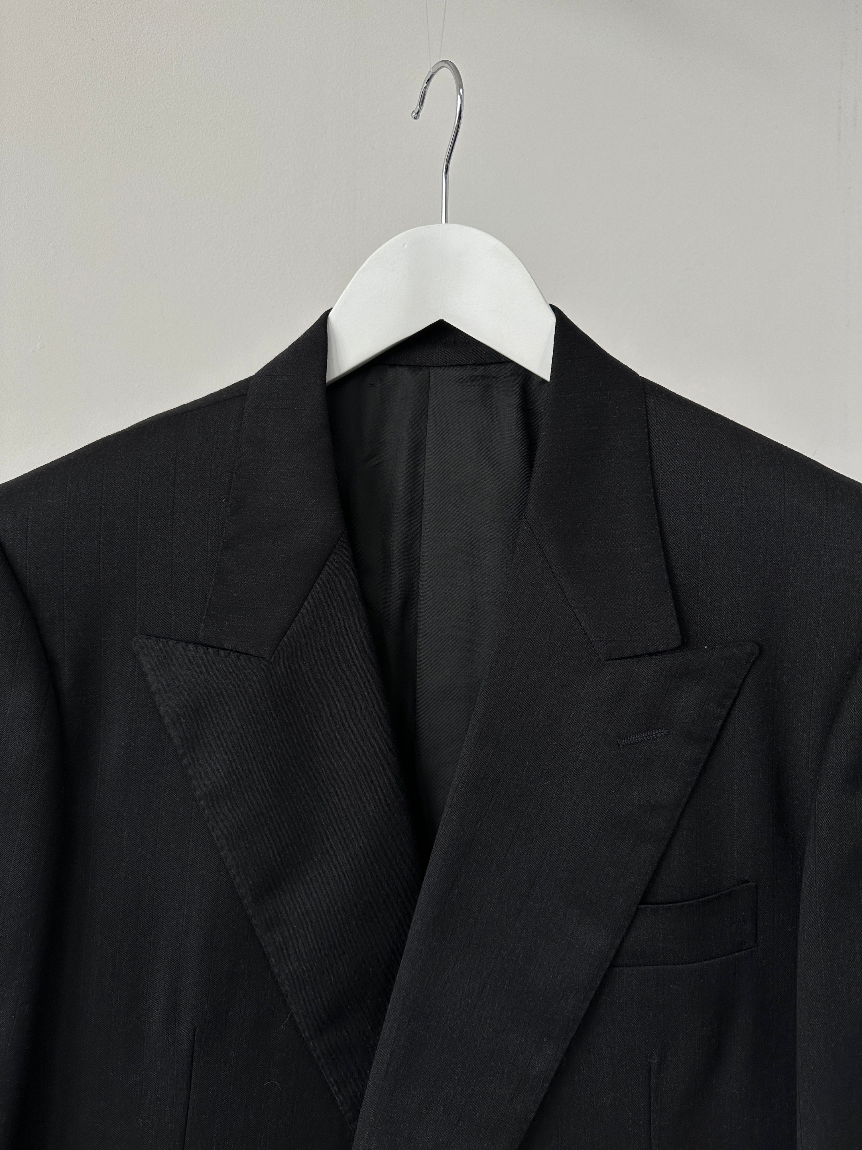 Pal Zileri oversized double-breasted blazer with wide lapel, tailored fit, and classic design in a neutral color.