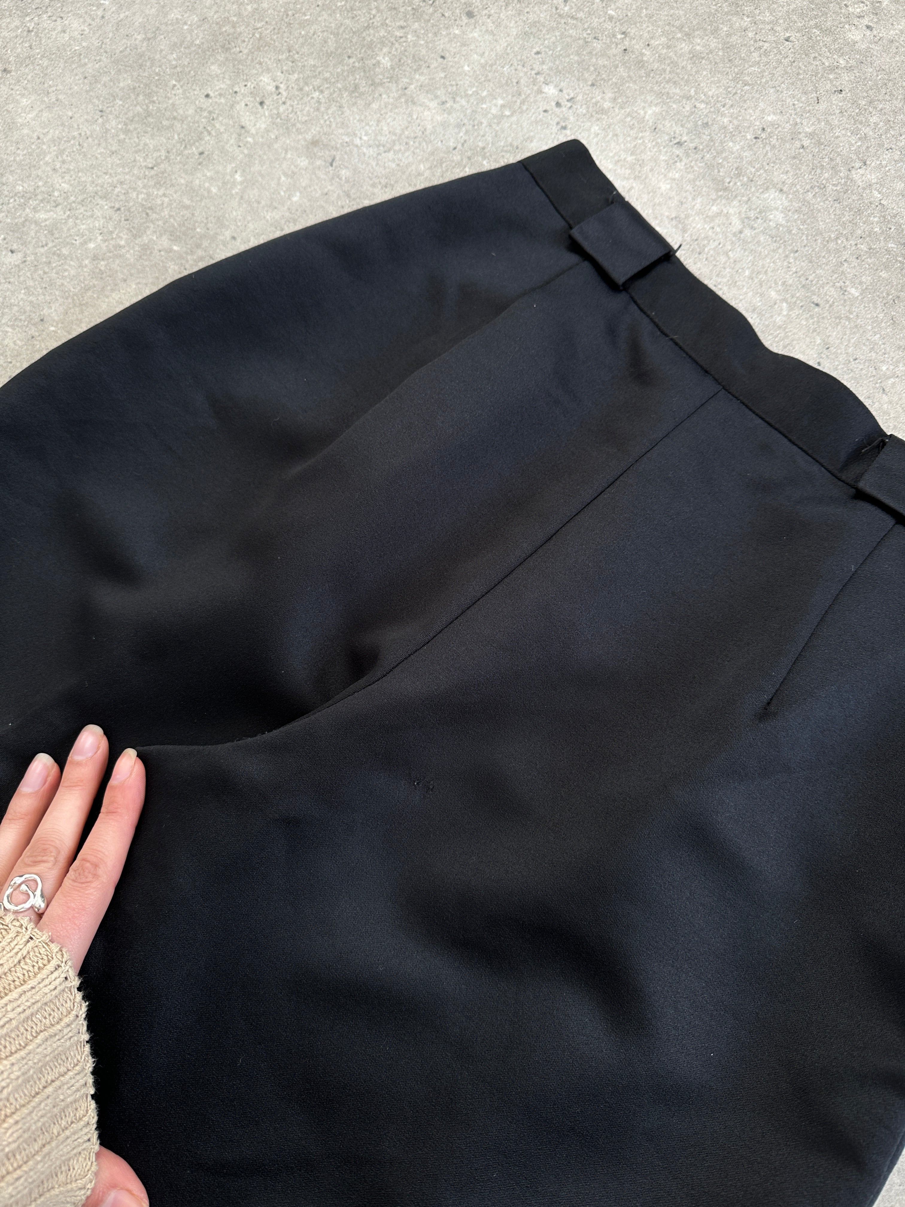 Vintage 1980s satin tapered leg high-waisted trousers, size W26, featuring a sleek, retro style with a smooth satin finish.