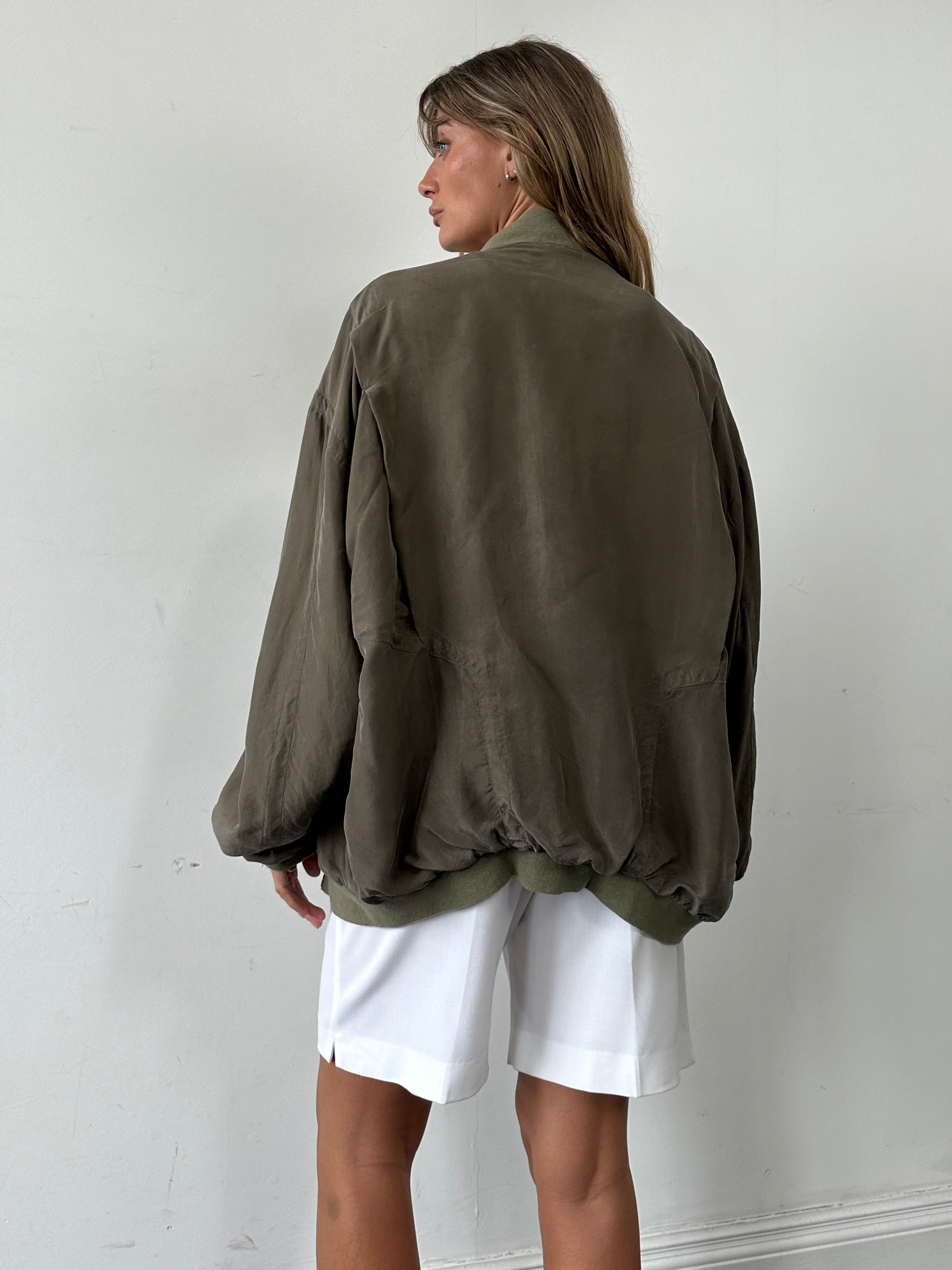 Pierre Cardin pure silk slouchy bomber jacket in XXL laid flat, showing its soft fabric and relaxed fit.