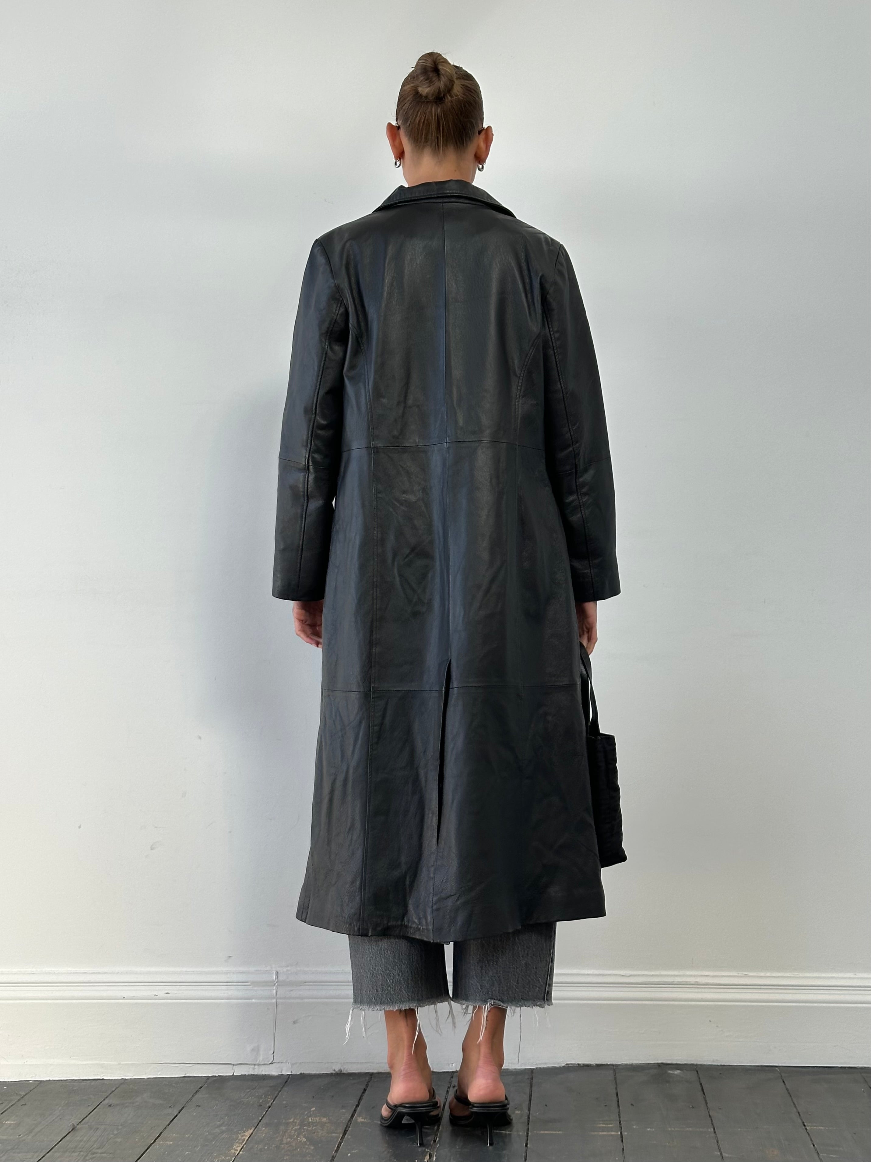 Vintage leather trench coat, floor length jacket in size M, featuring classic design and durable leather material.