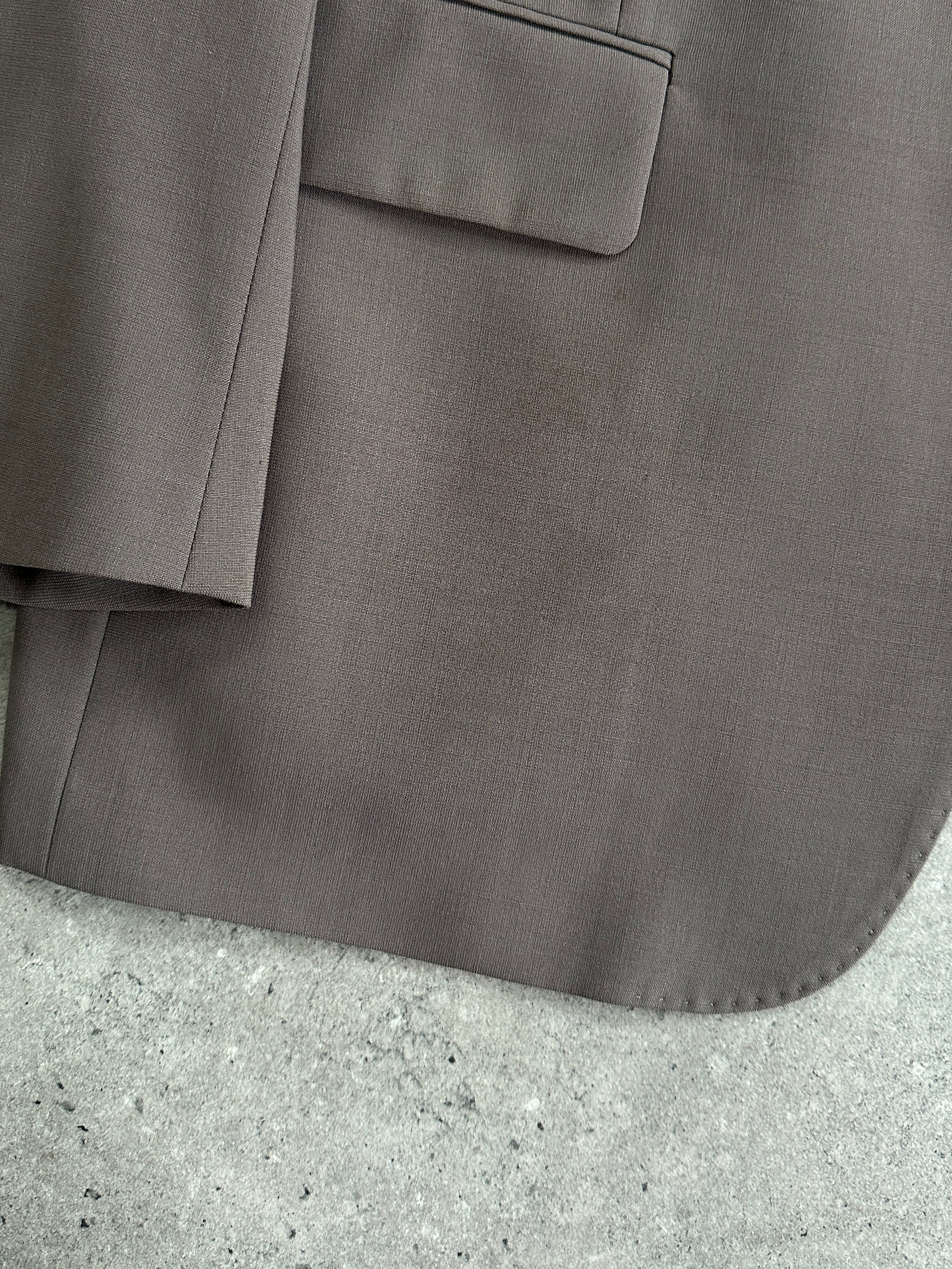 Vintage wool single-breasted suit jumpsuit in size 42S/W34, featuring classic tailored design and vintage style details.