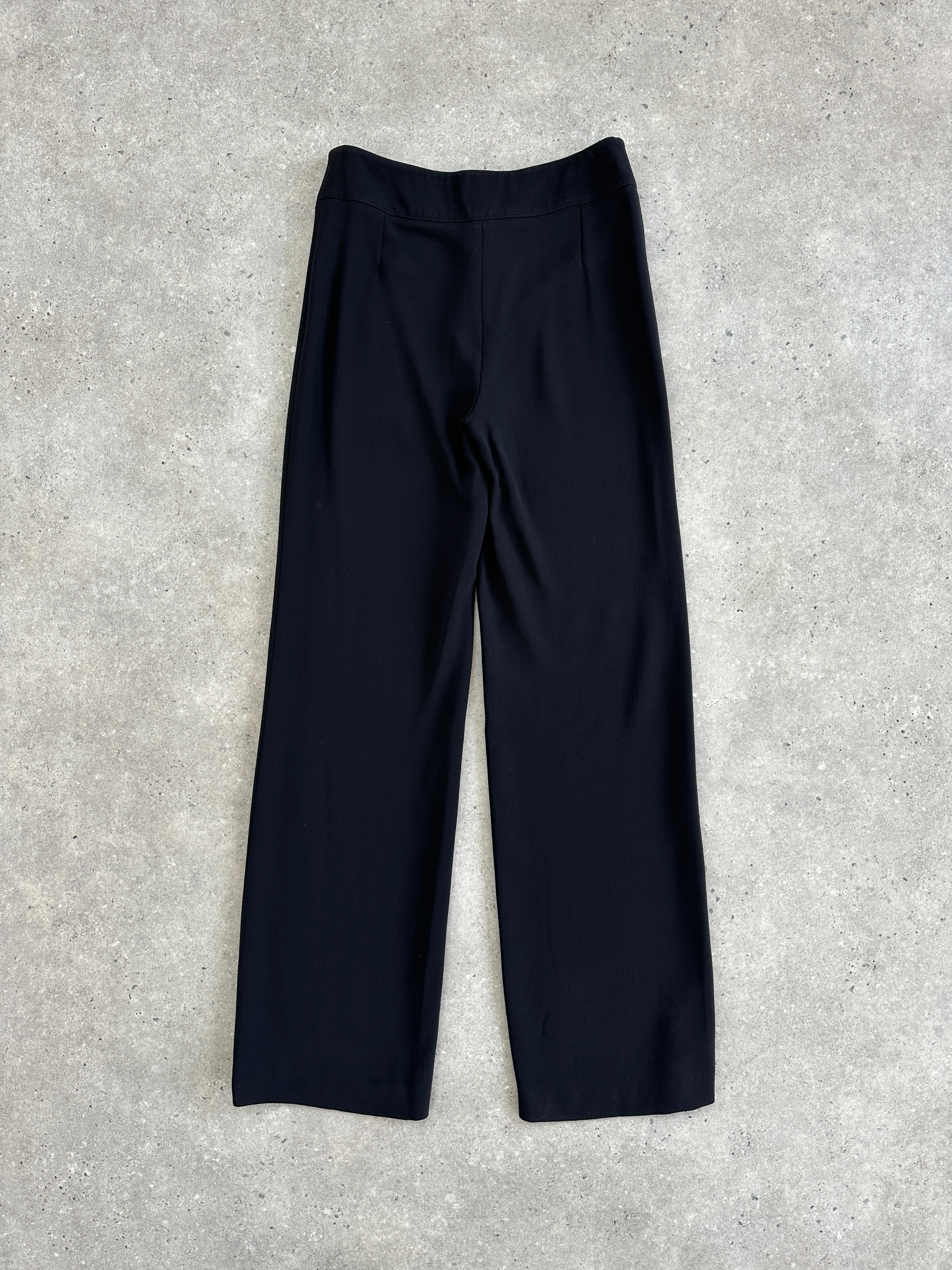 Armani Collezioni wool low waist wide-leg trousers in dark fabric, shown flat with tailored fit and wide leg design.