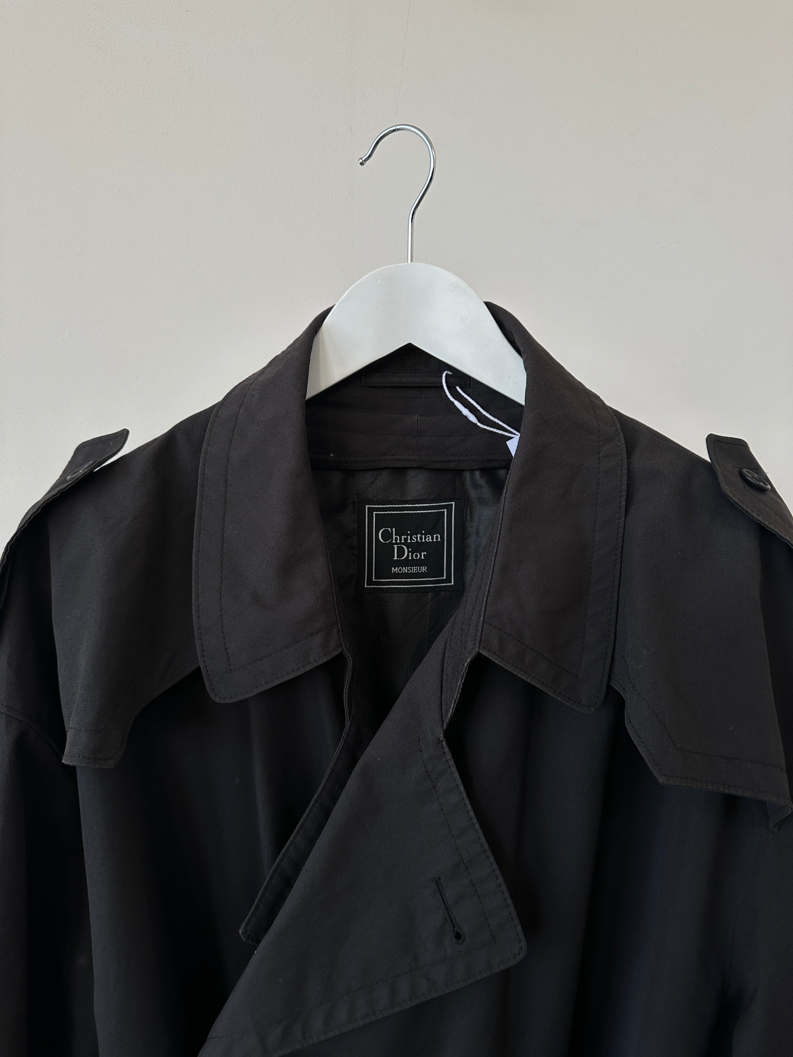 Christian Dior cotton double-breasted belted trench coat in XXL, featuring classic design and tailored fit, displayed on a hanger.