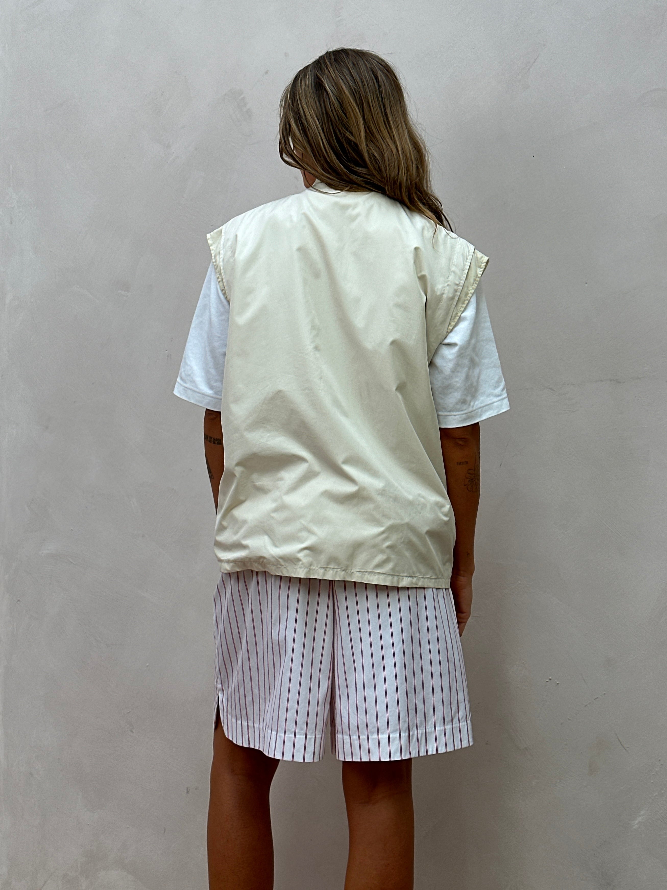 Prada sleeveless nylon vest with double zippers in XL size, featuring a sleek design and lightweight construction.